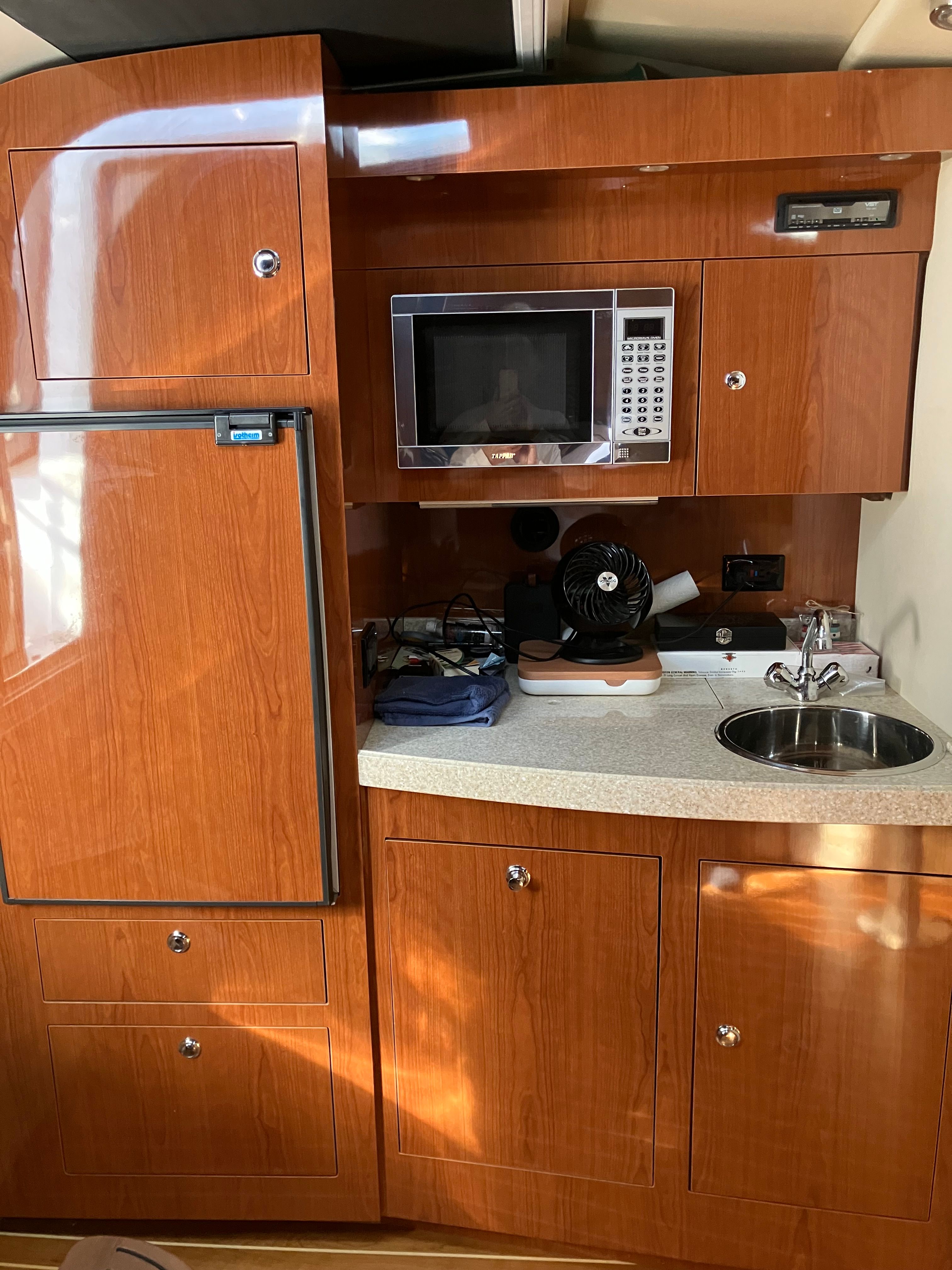 Kitchen area in a 2008 Custom Commodore boat.