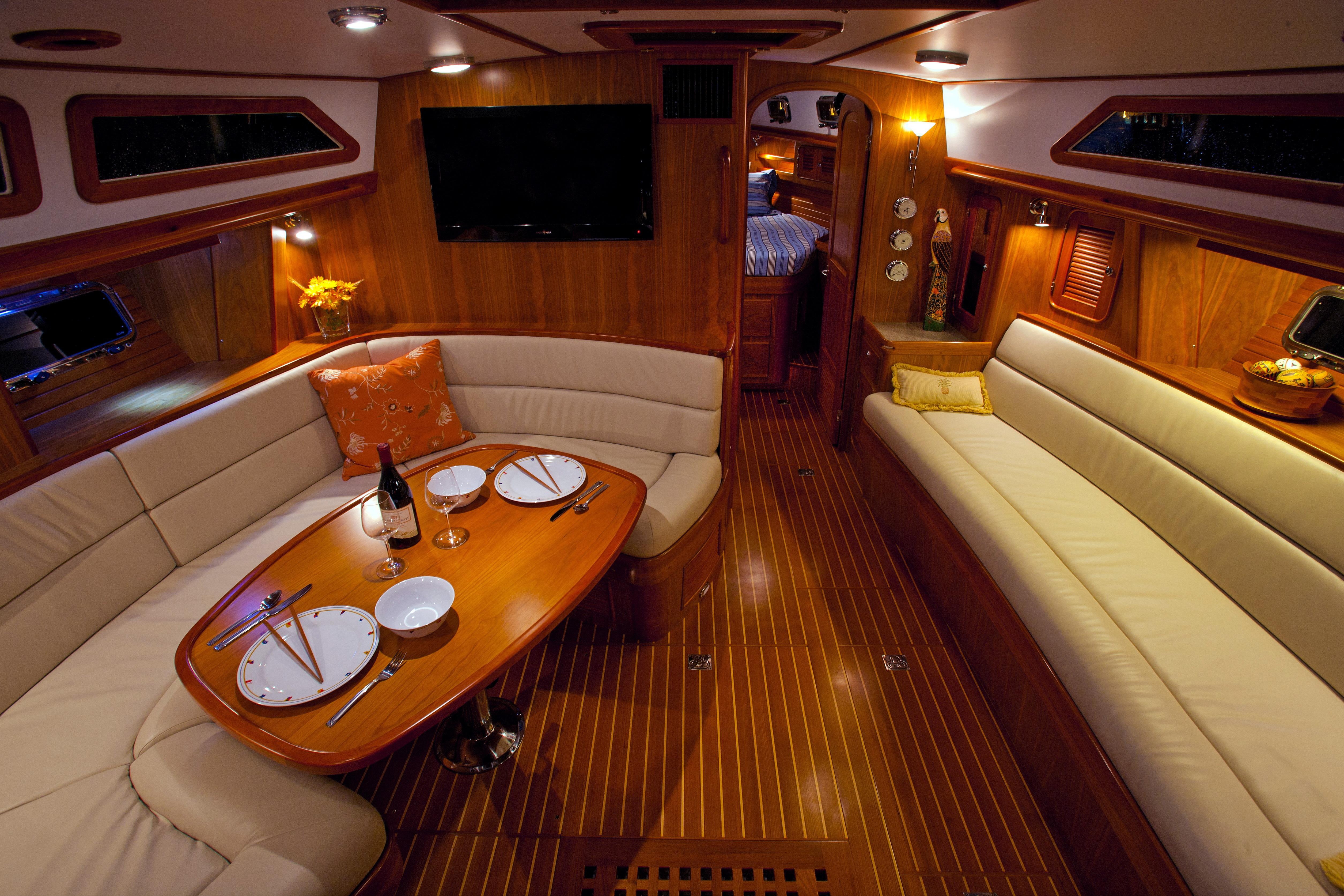 Luxurious interior of 2013 Passport 470 Center Cockpit yacht with elegant dining area.
