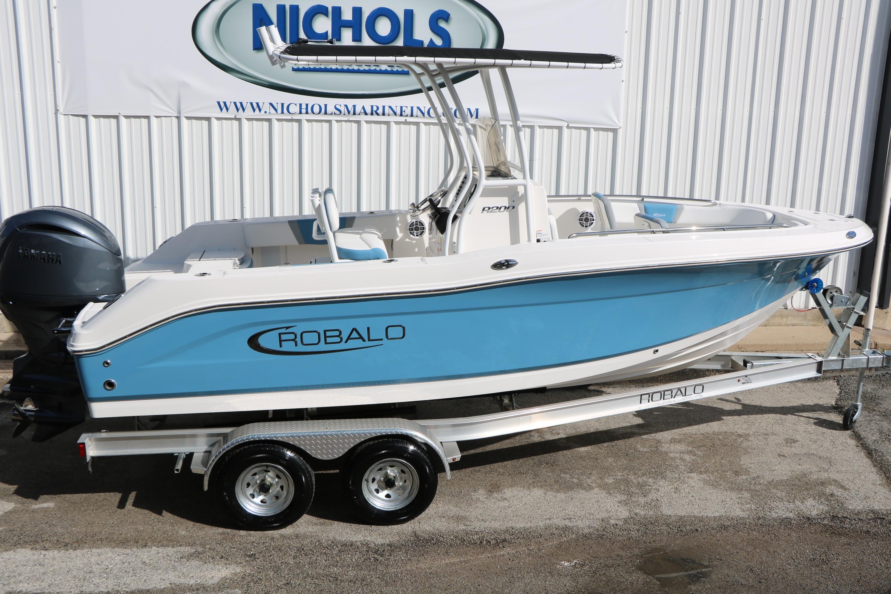 2026 Robalo R200 Center Console boat on trailer, blue and white design.