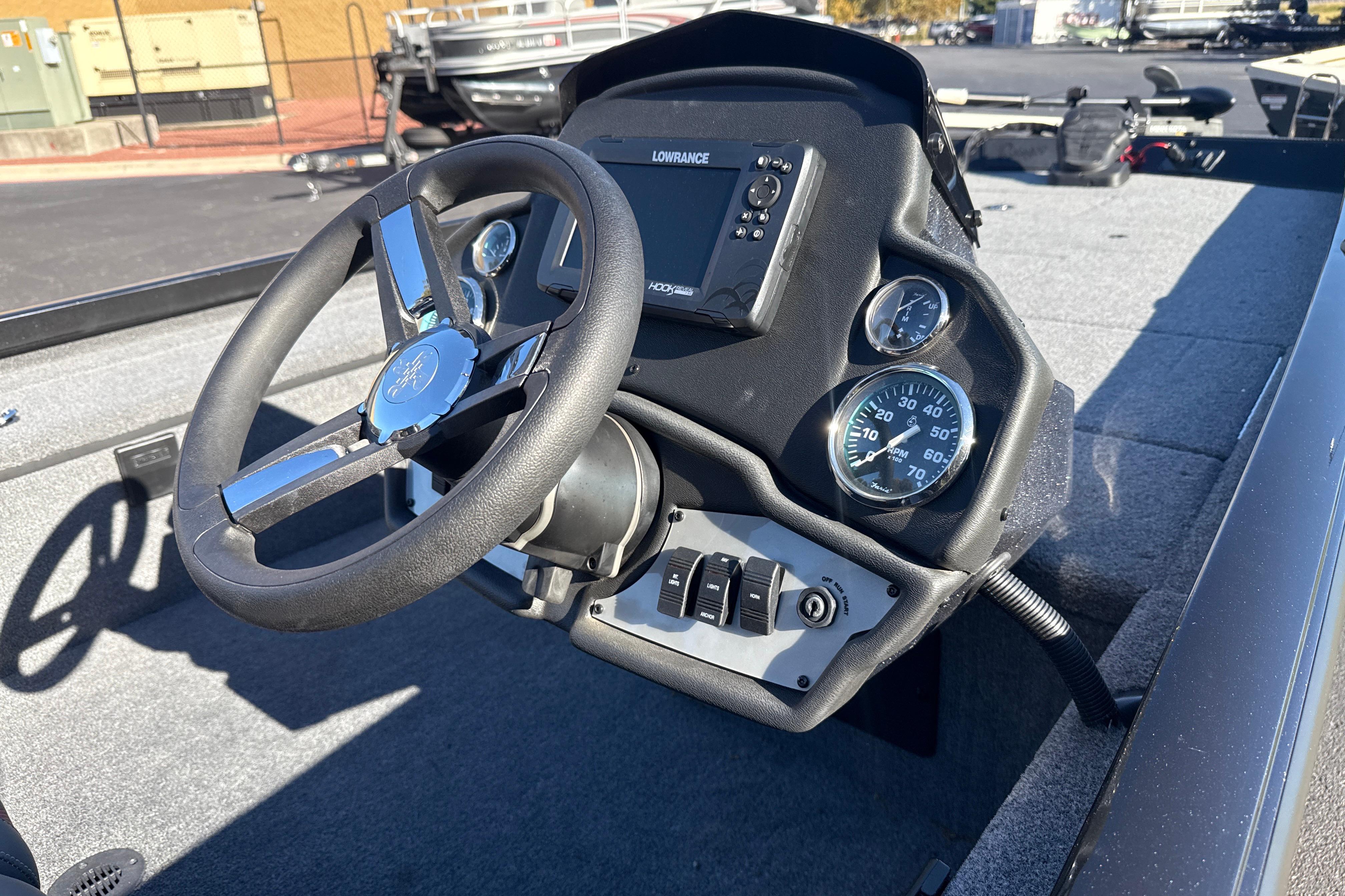 2025 Ranger RT188C boat dashboard with steering wheel and gauges.