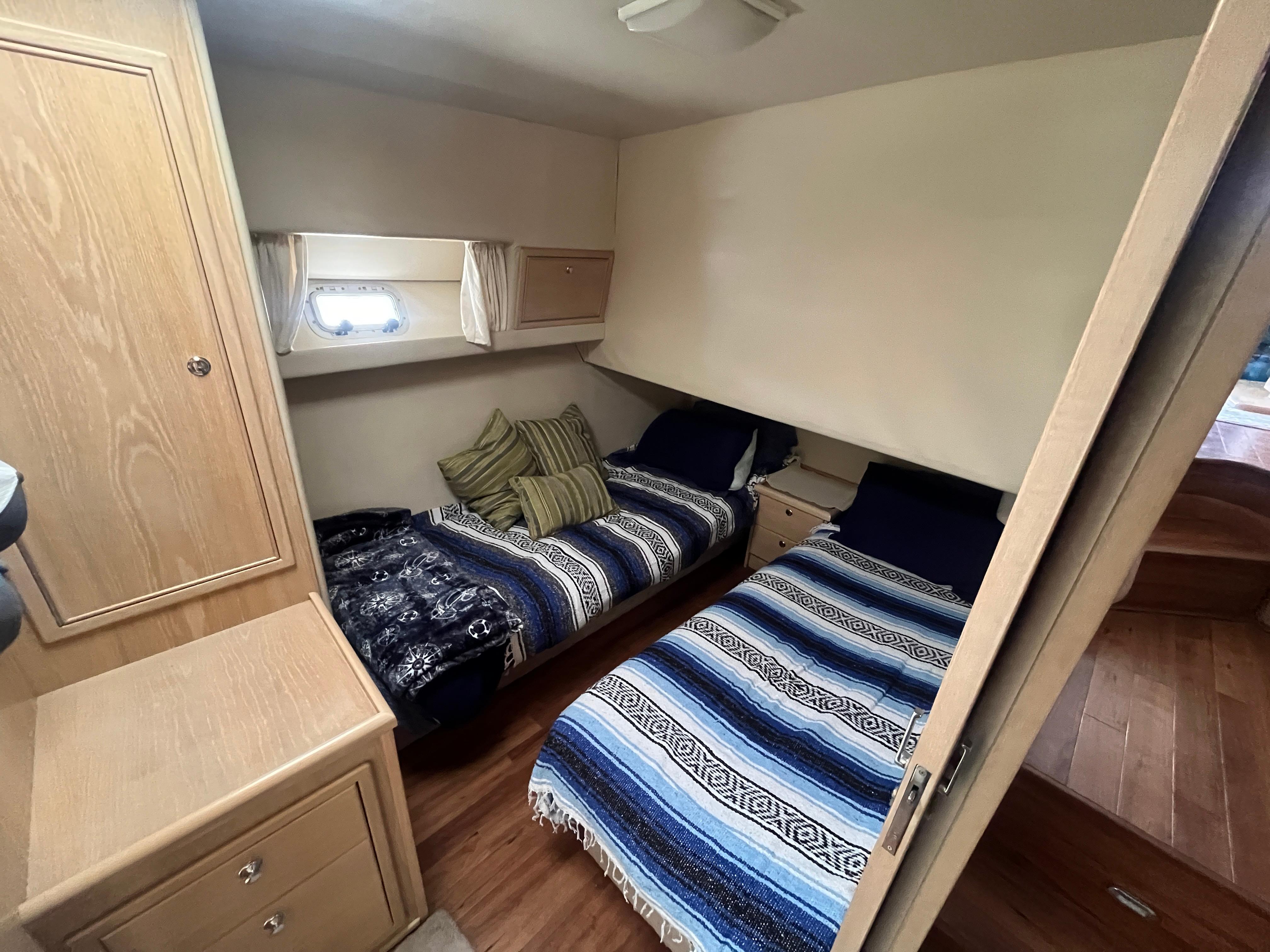 Interior of 1997 Riviera 43 Open Flybridge with twin beds.