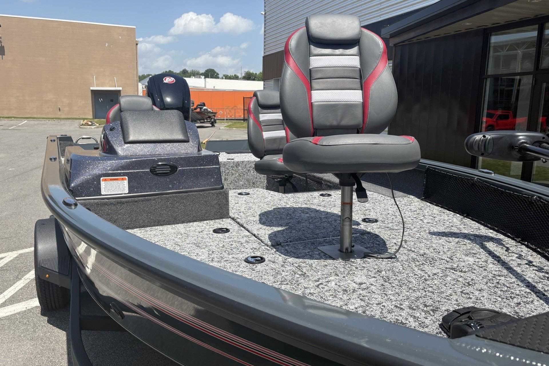 2026 Ranger VS1782SC Angler boat with gray and red seating, parked outdoors.