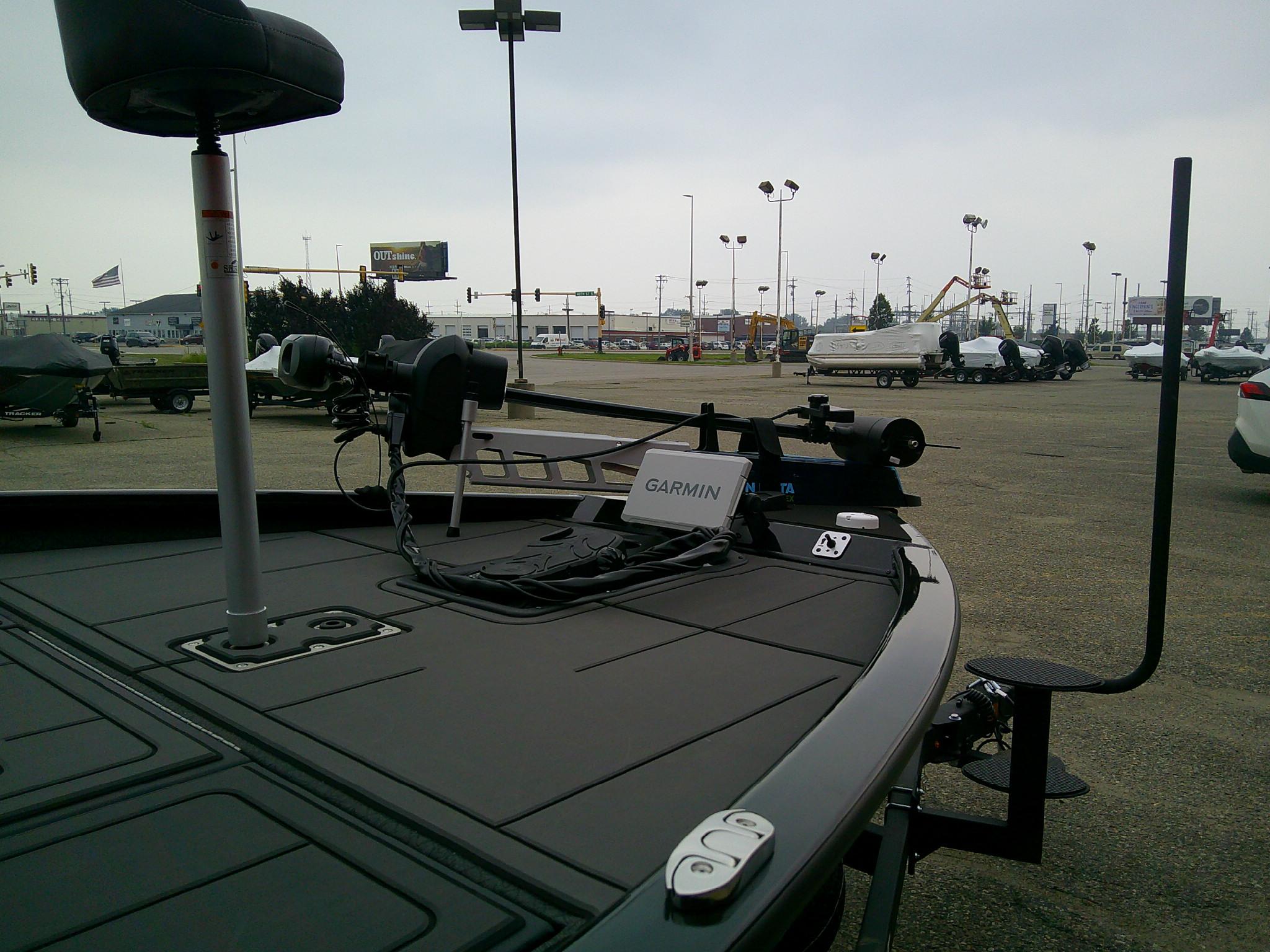 2025 Tracker Savage 215 boat with Garmin equipment in a parking lot.