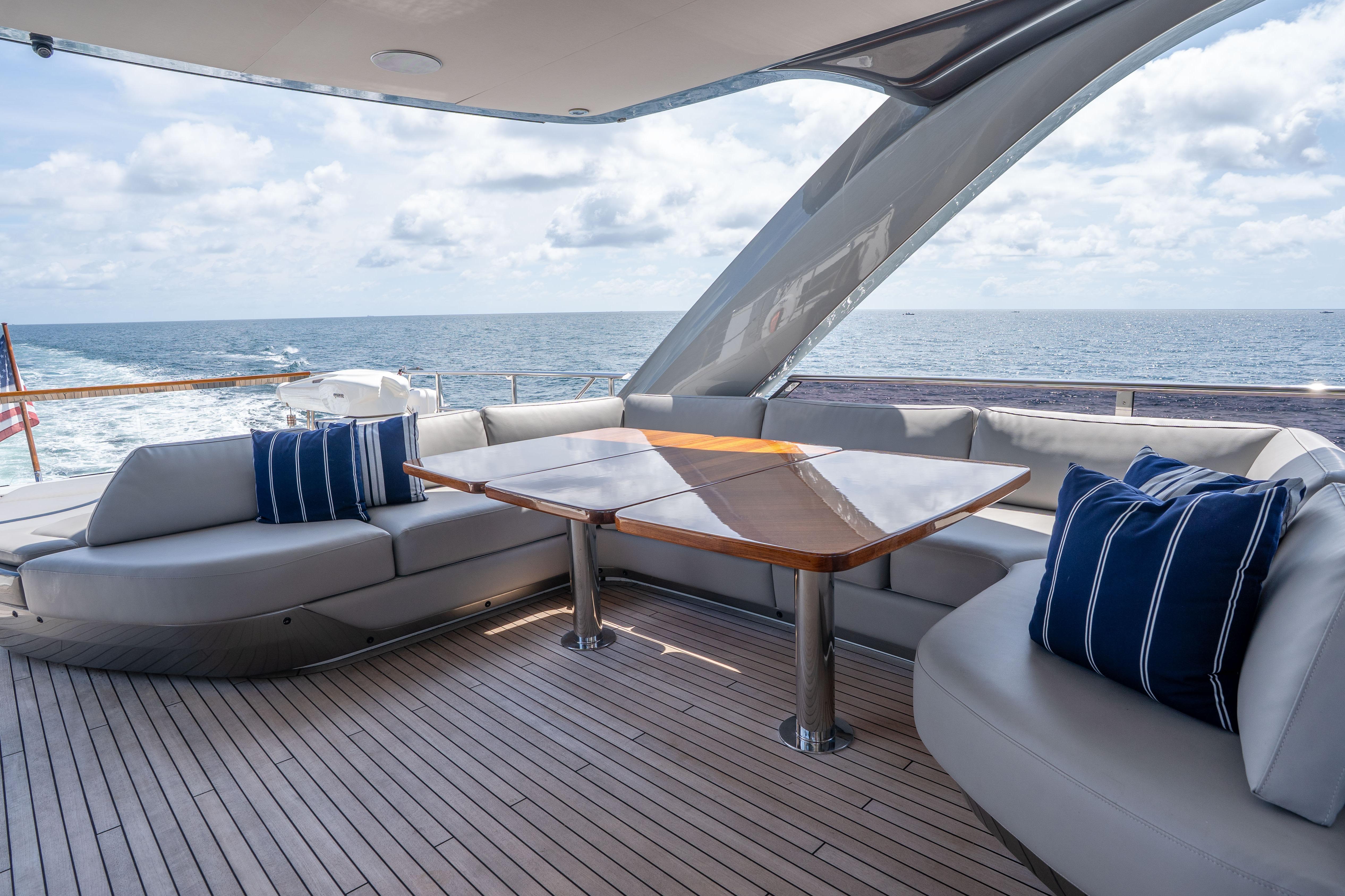 Luxurious 2020 Princess Y85 yacht deck with elegant seating and ocean view.