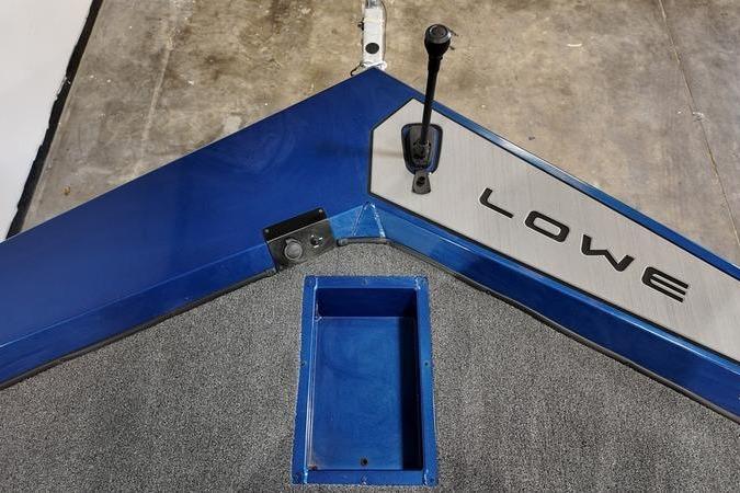 2024 Lowe Stinger 198 boat deck with blue accents and control lever.