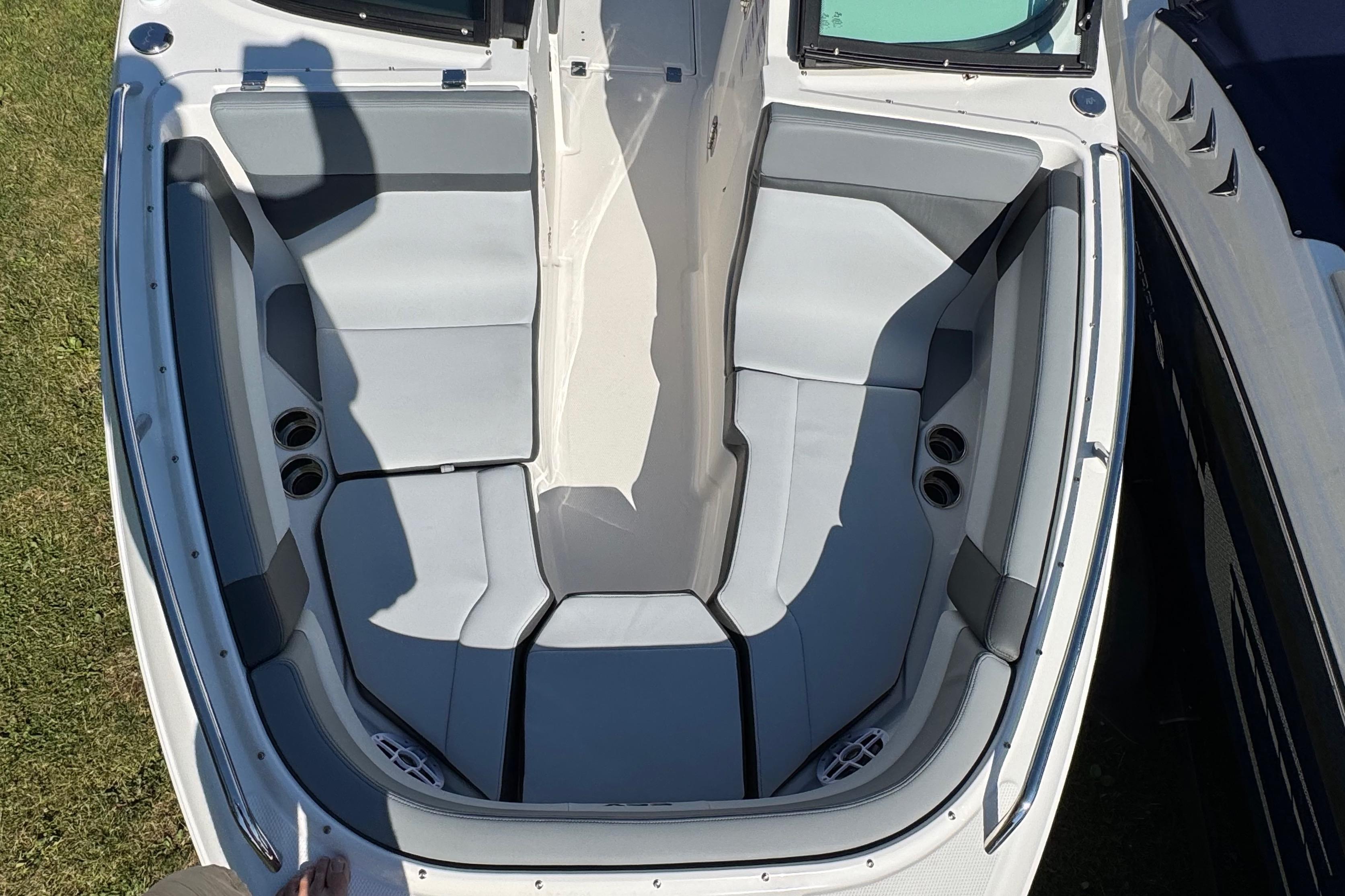 2026 Chaparral SSX 4 boat interior with gray seating and cup holders.