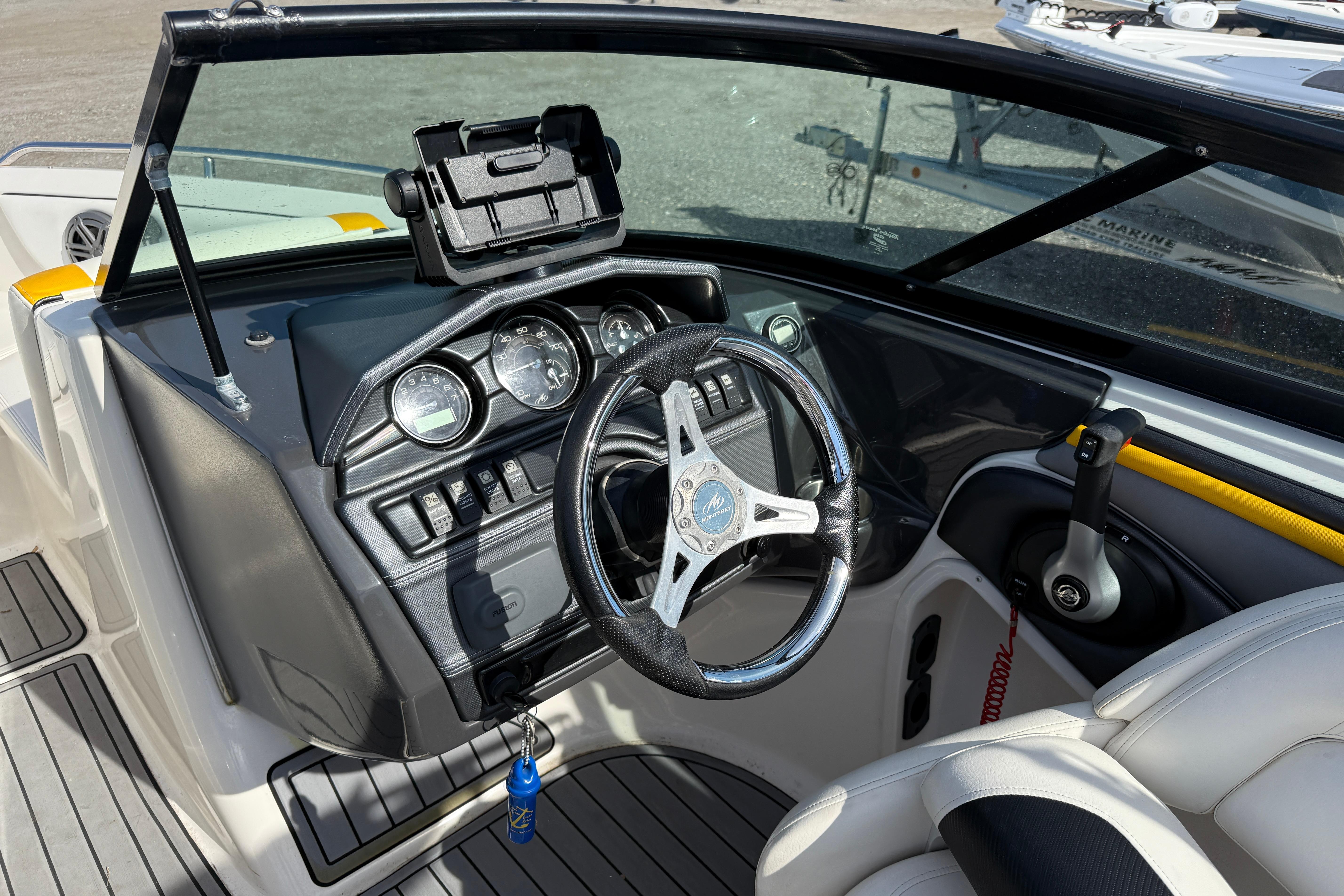 2014 Monterey 197 Blackfin boat dashboard with steering wheel and controls.
