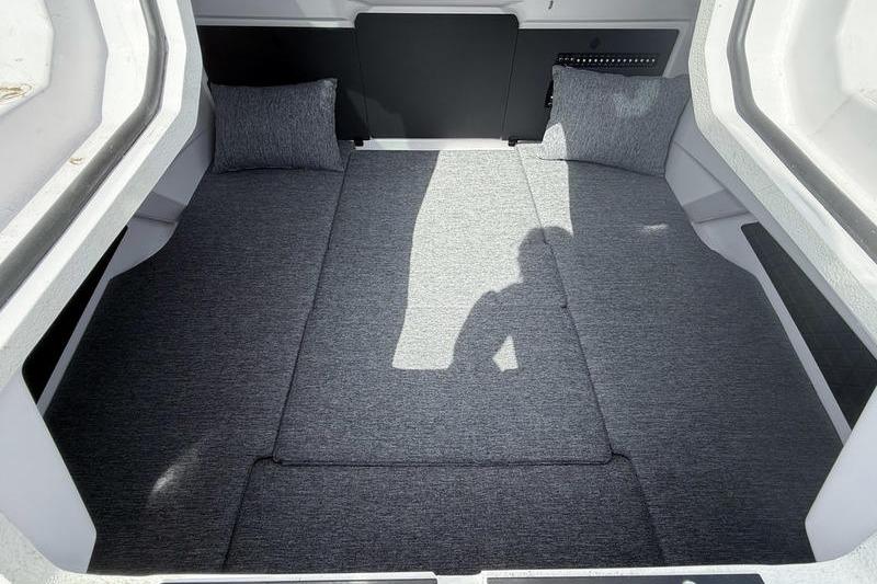 2025 Axopar 29 XC Cross Cabin interior with gray cushions and modern design.