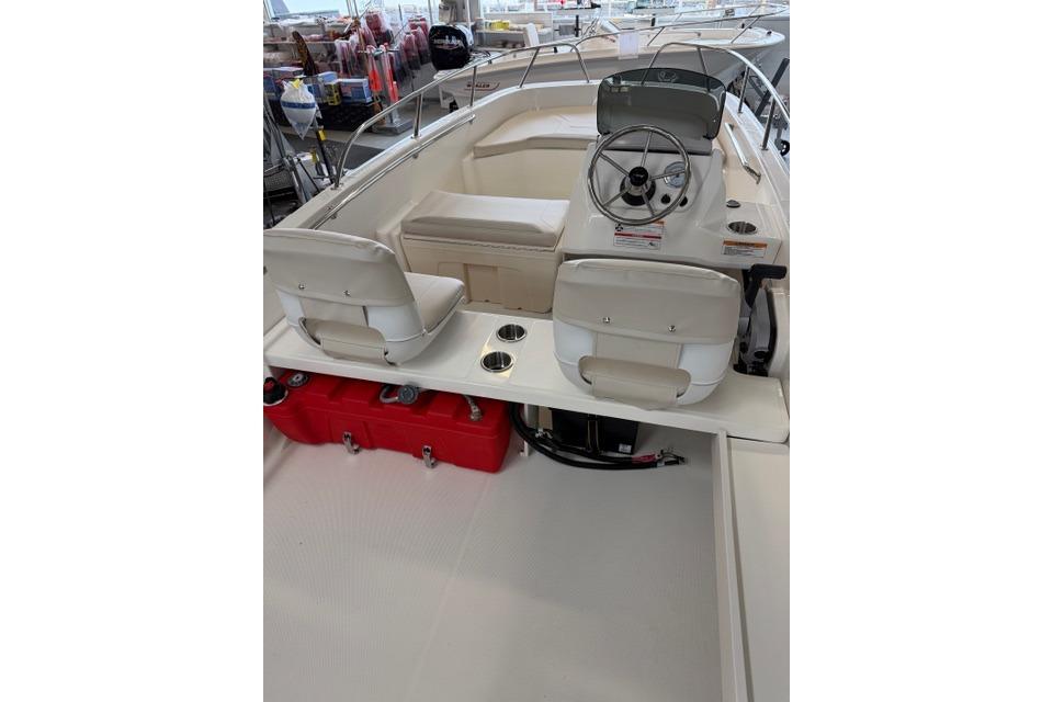 2026 Boston Whaler 160 Super Sport boat interior with steering wheel and seating.