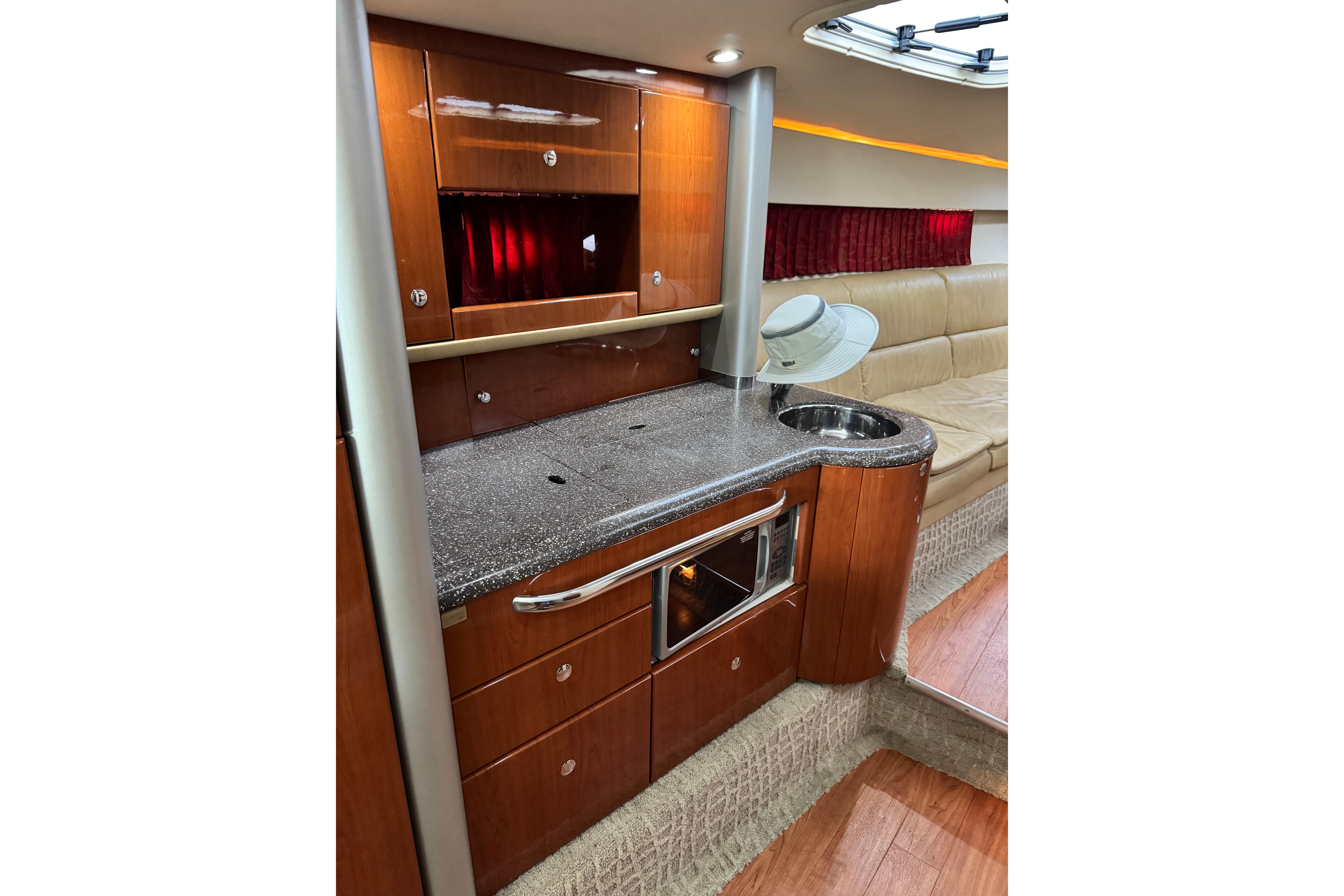 Luxurious interior of a 2008 Formula 400 Super Sport yacht with modern kitchenette.