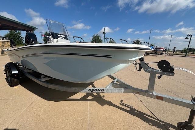 2026 Mako Pro Skiff 15 CC boat on trailer under clear blue sky.