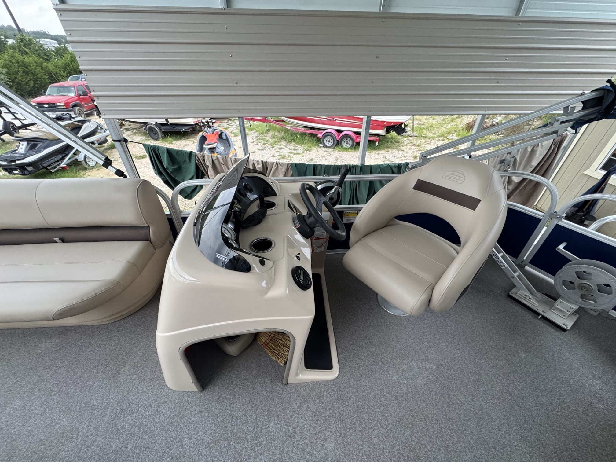 Interior view of a 2018 Sun Tracker Party Barge 18 DLX with helm and seating area.