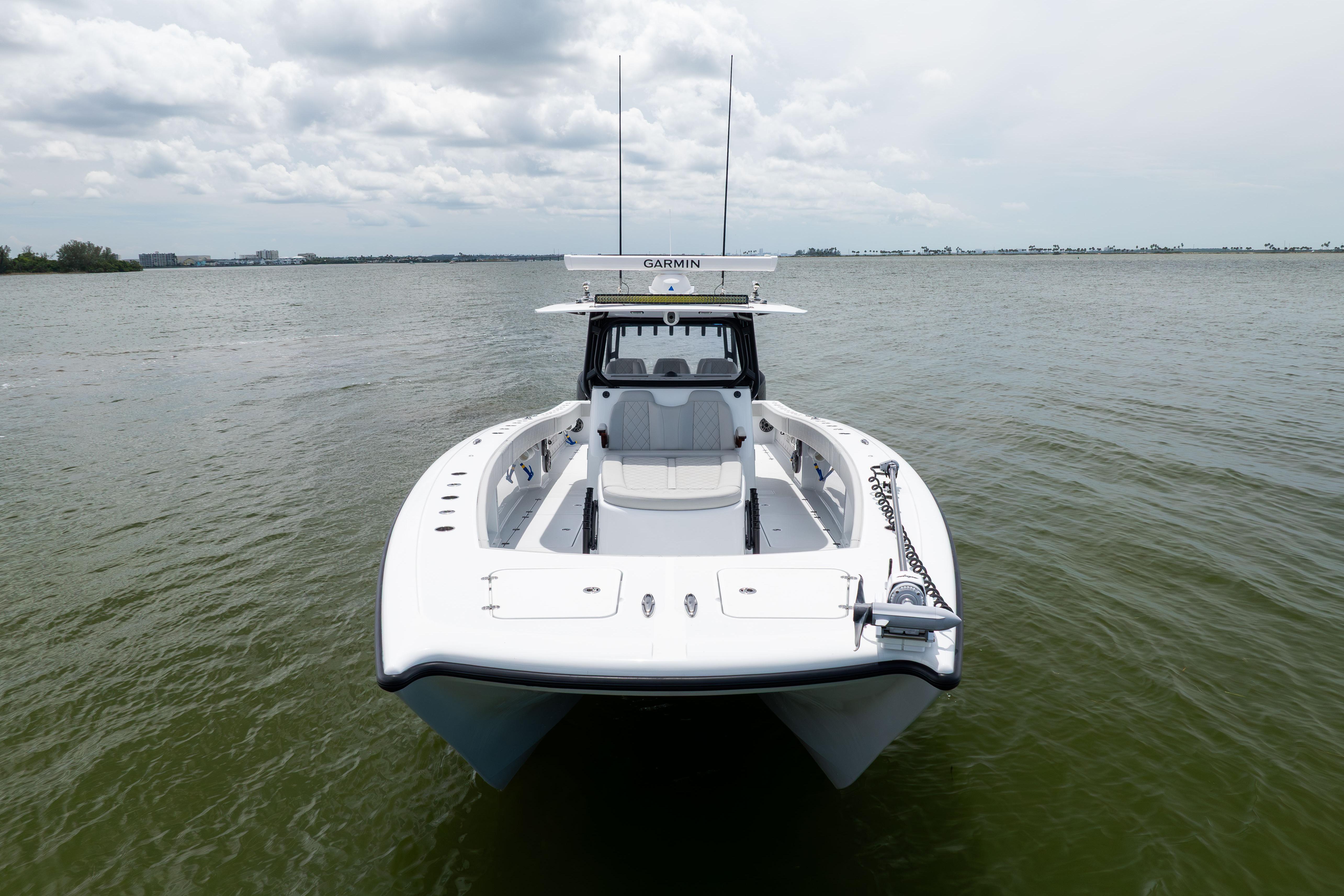 2025 Freeman 42 LR boat on calm water, front view, overcast sky.