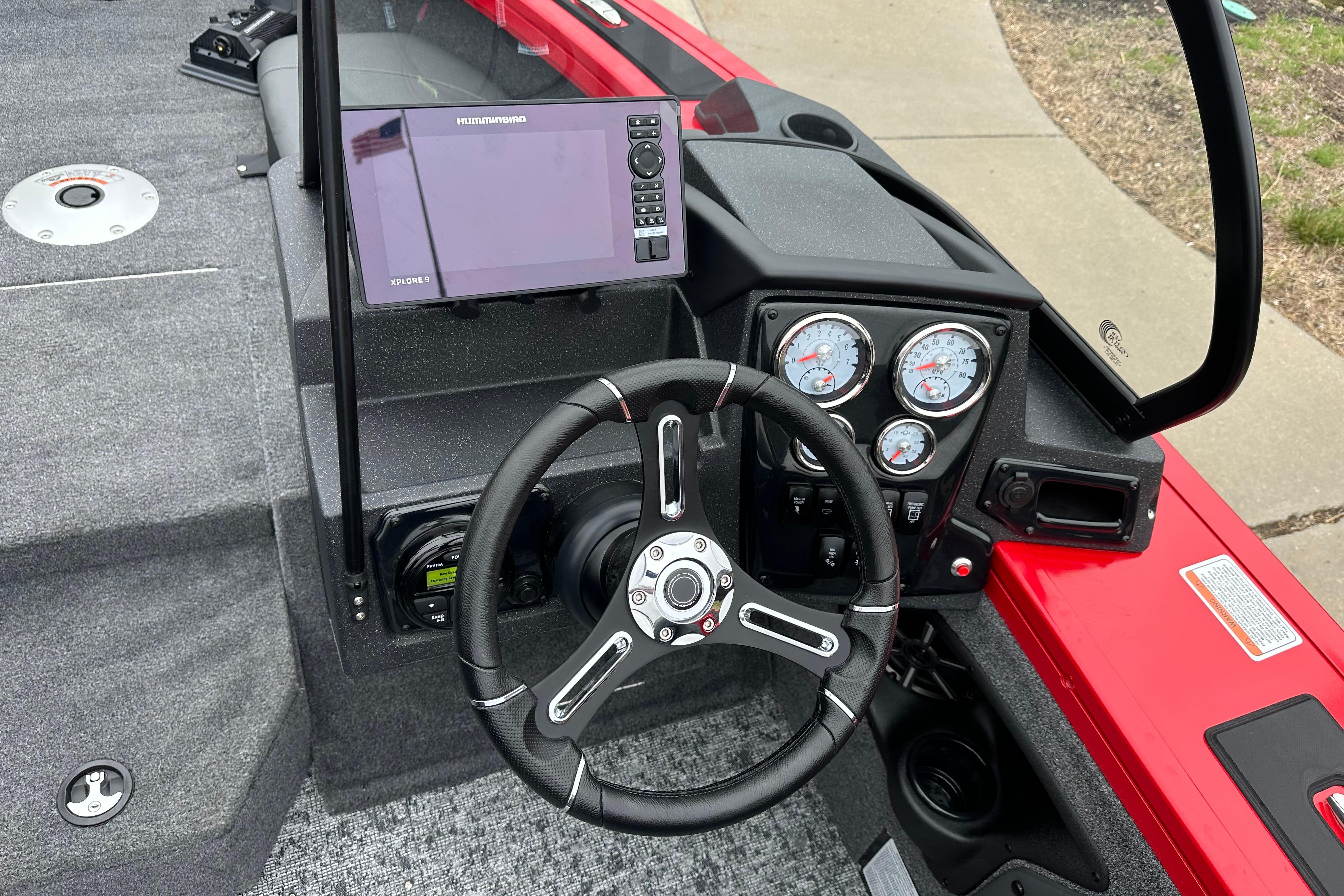 2026 Tracker Targa V-19 Combo boat dashboard with steering wheel and navigation display.