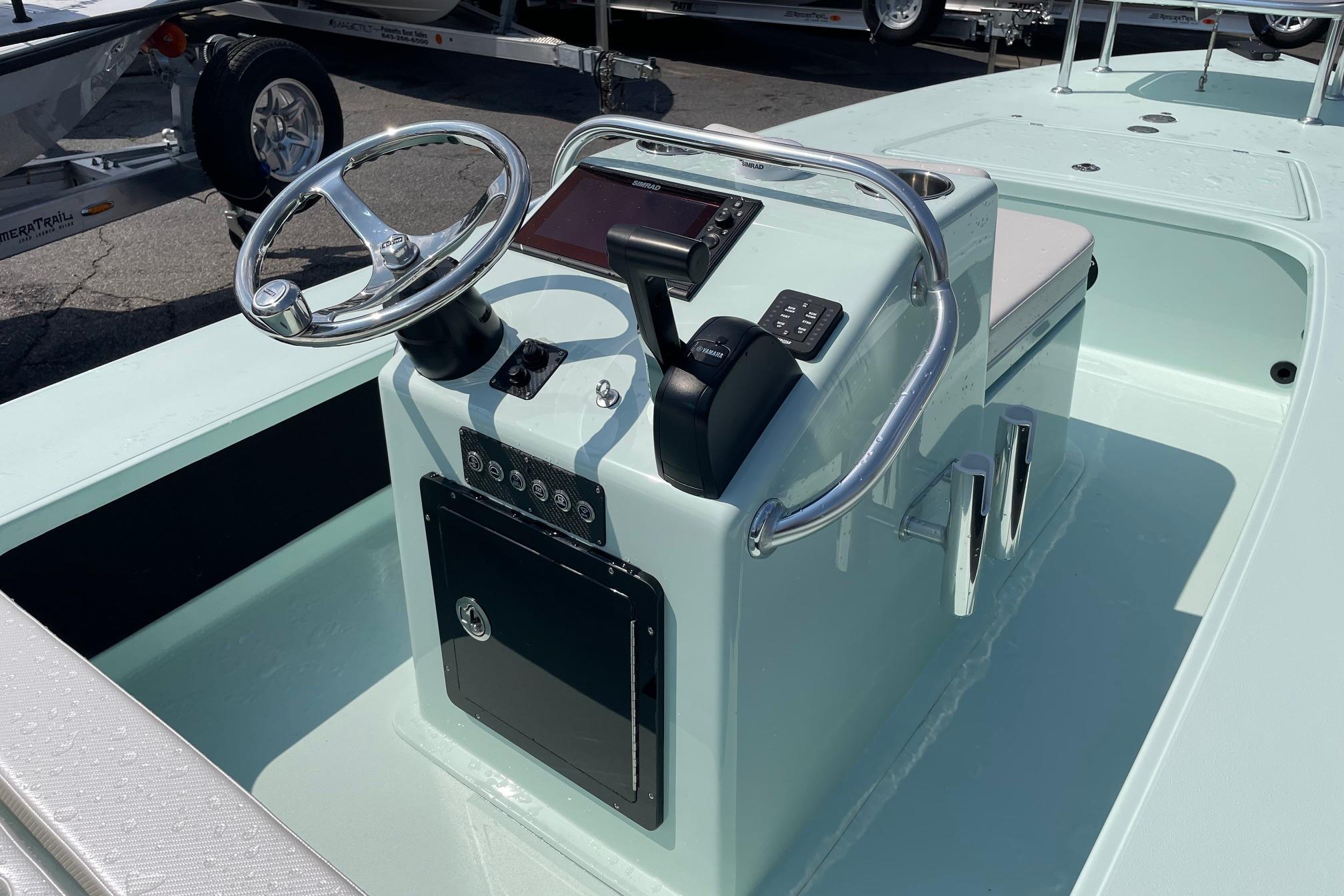 2026 Chittum Skiffs Islamorada 18 boat console with steering wheel and controls.