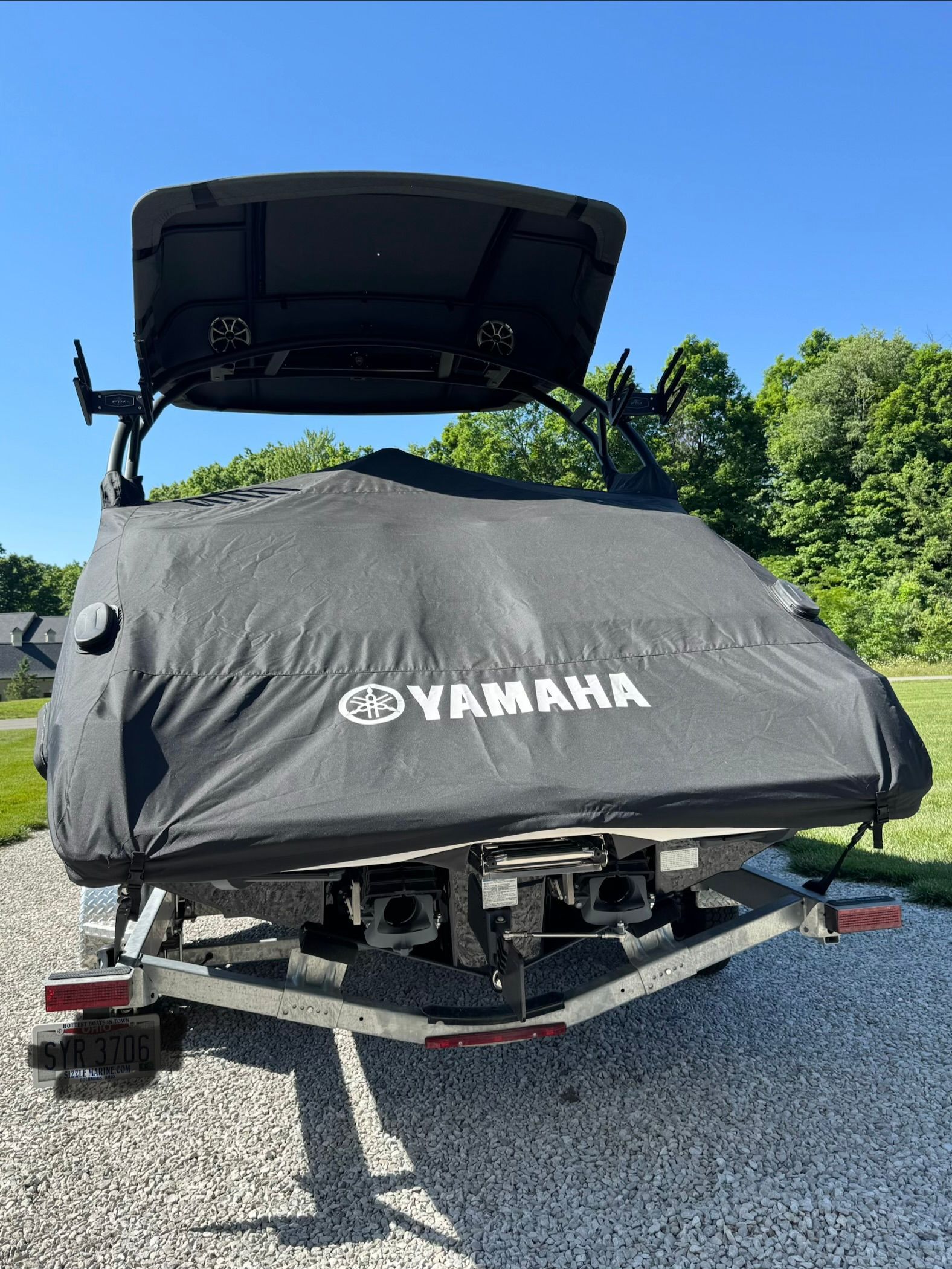 Yamaha 255XD boat with cover on a trailer.