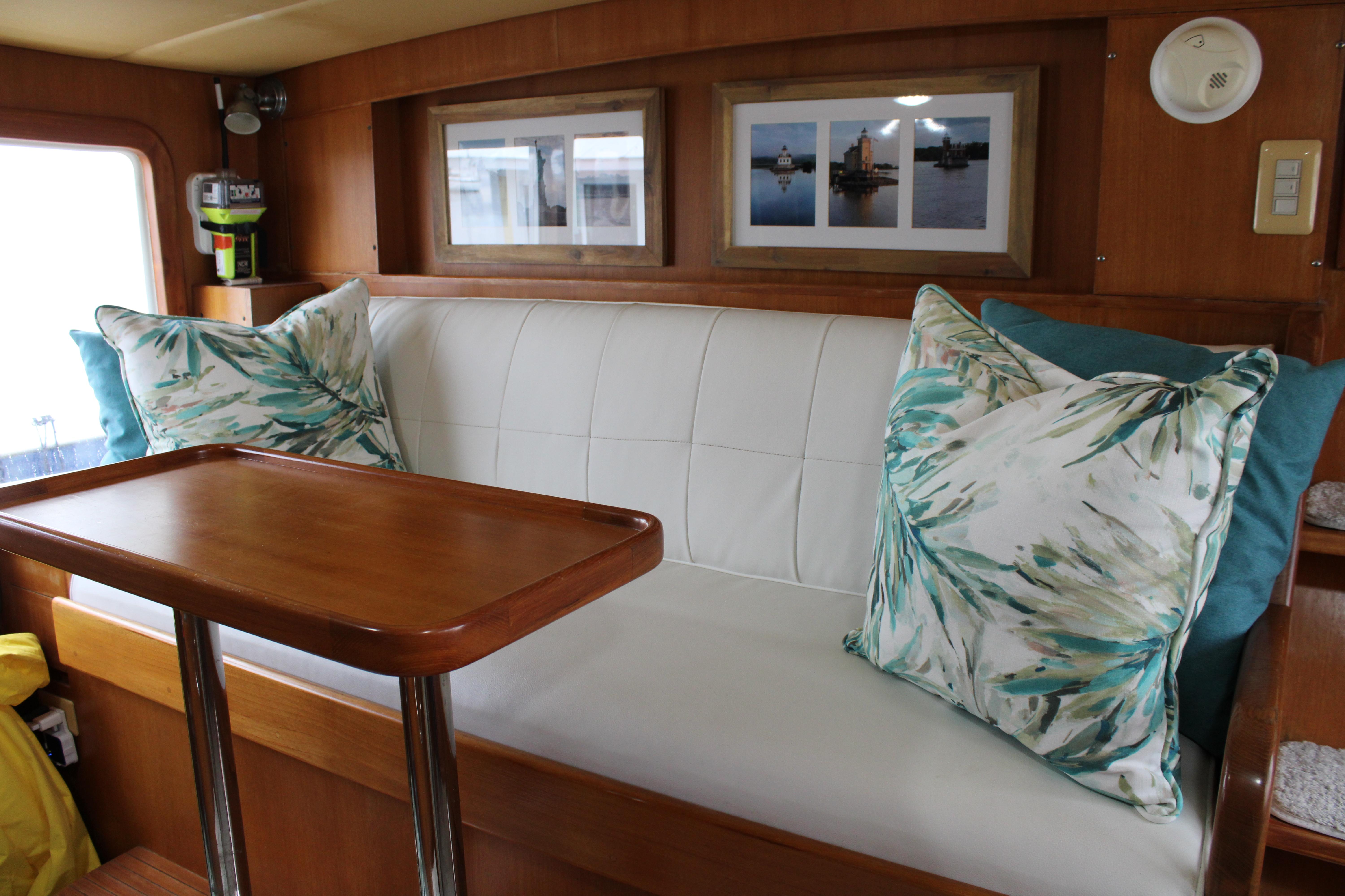 Interior of a 1996 Krogen Express 49' yacht with cozy seating area.