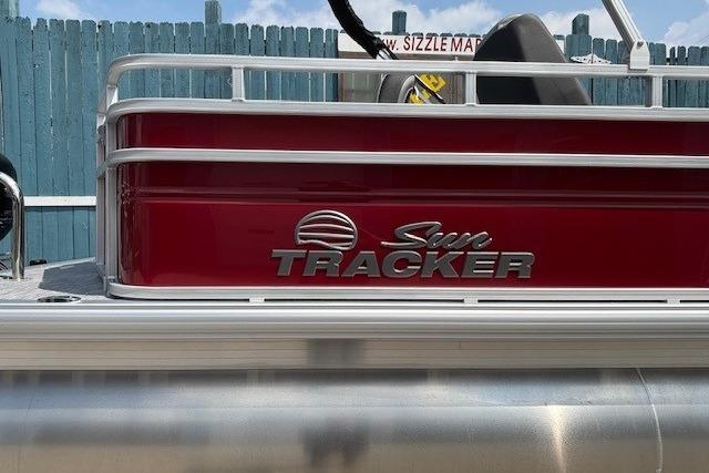 2026 Sun Tracker SportFish 20 DLX pontoon boat with red exterior and logo.