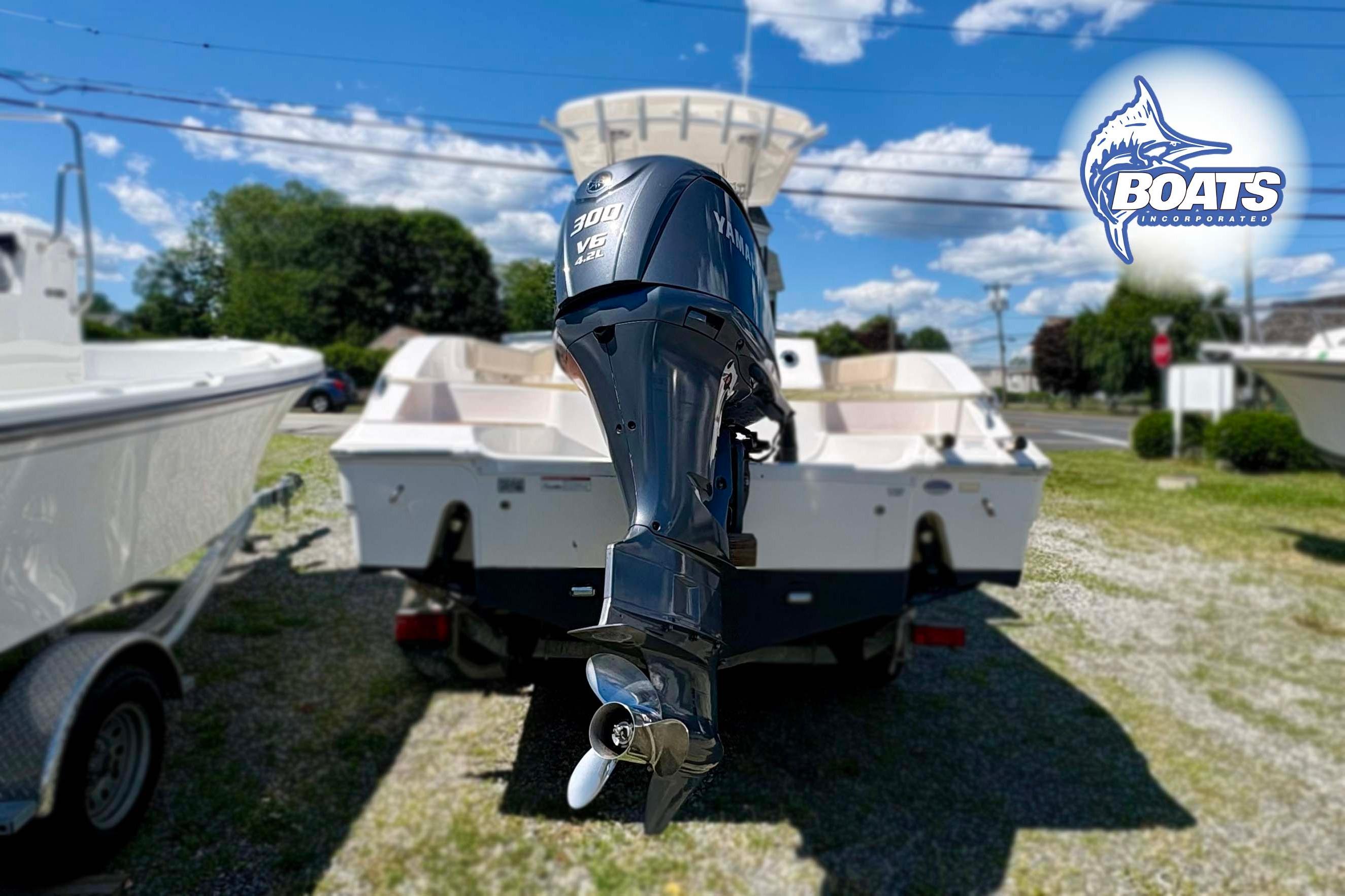 2015 Sea Fox 266 Commander boat with Yamaha 300 V6 engine, displayed outdoors.