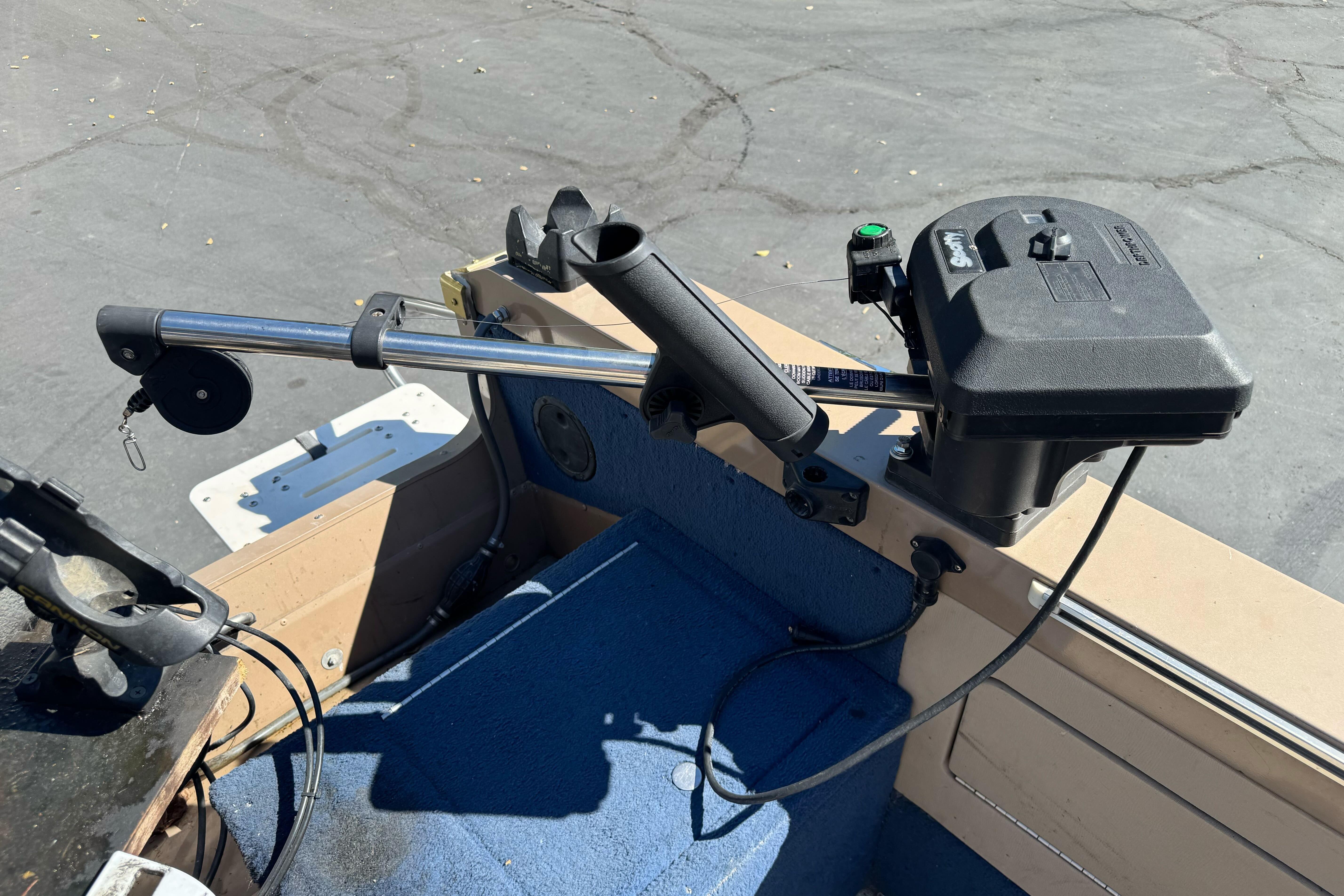 1998 Lund 1700 Pro Sport boat interior with trolling motor and rod holder.