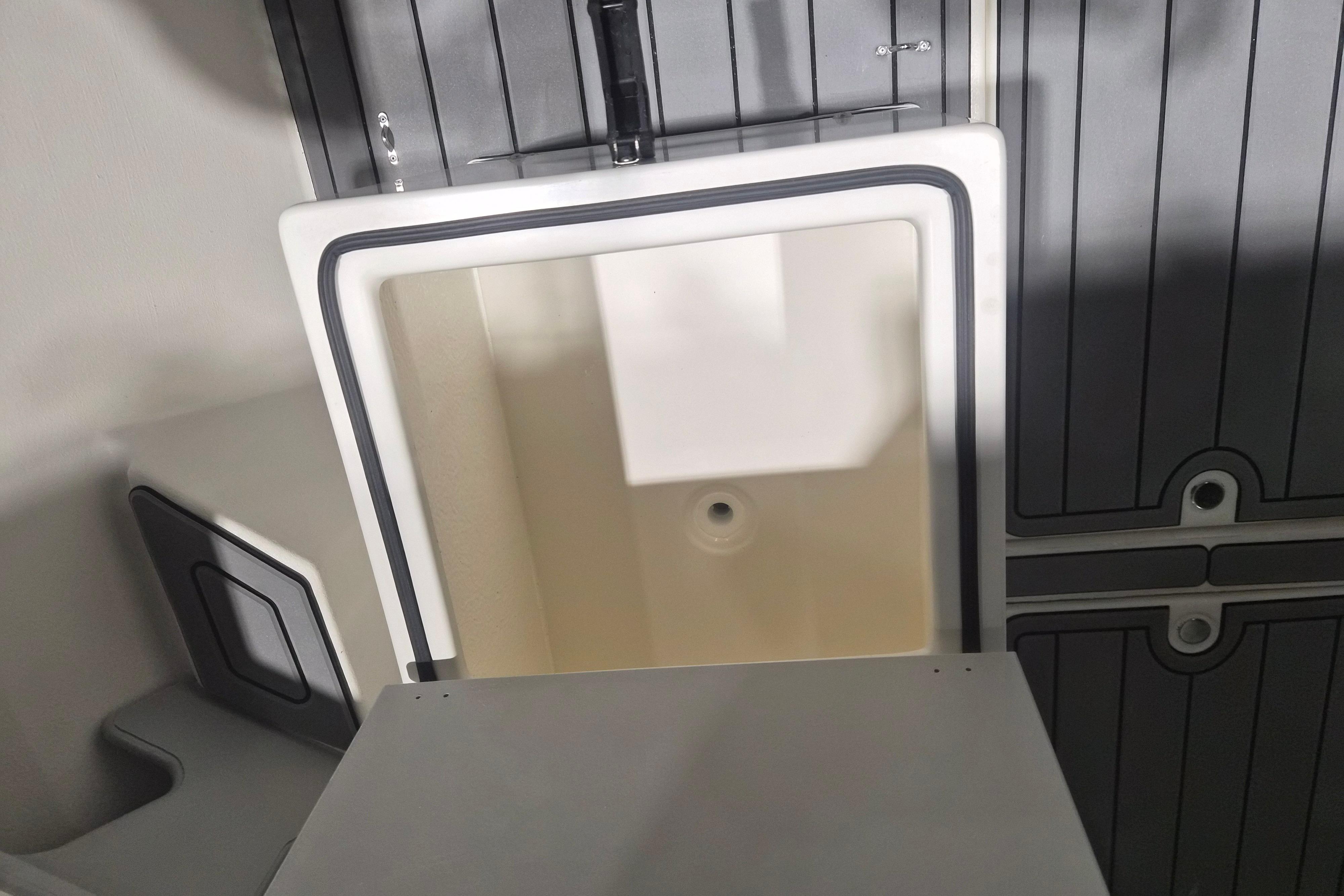 Interior storage compartment of 2026 Arima Sea Chaser 19 Yellowtail Edition boat.