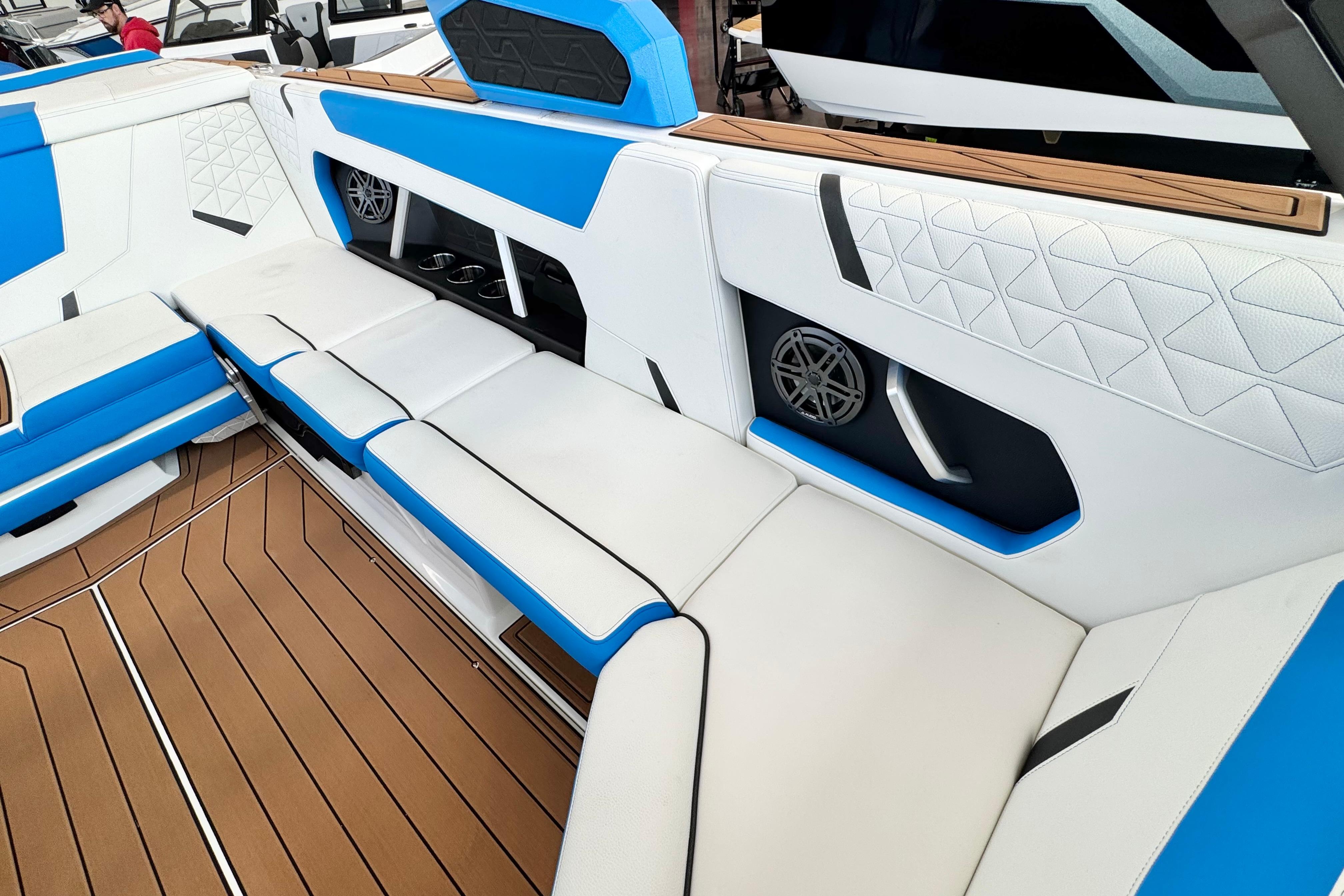 2026 Nautique Super Air Nautique GS22 interior with blue and white seating, wood accents.