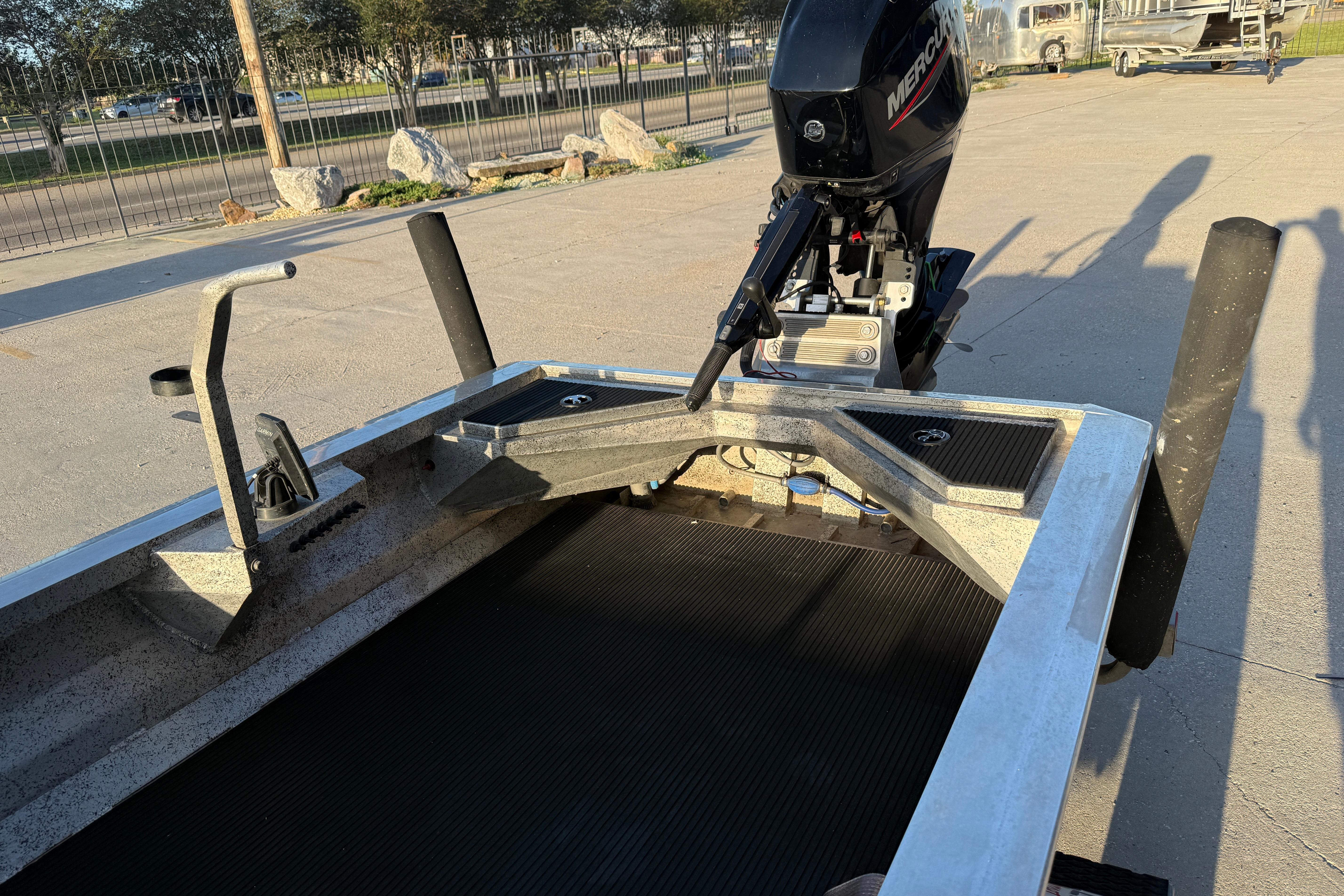 2017 Homemade 1754 boat with Mercury outboard motor in a parking lot.