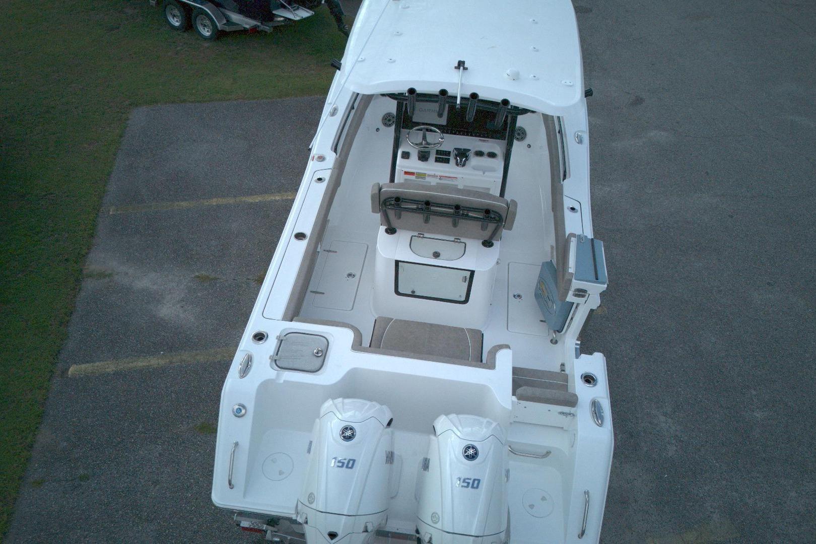2026 Sea Hunt Gamefish 25 boat, aerial view, showcasing deck and dual engines.