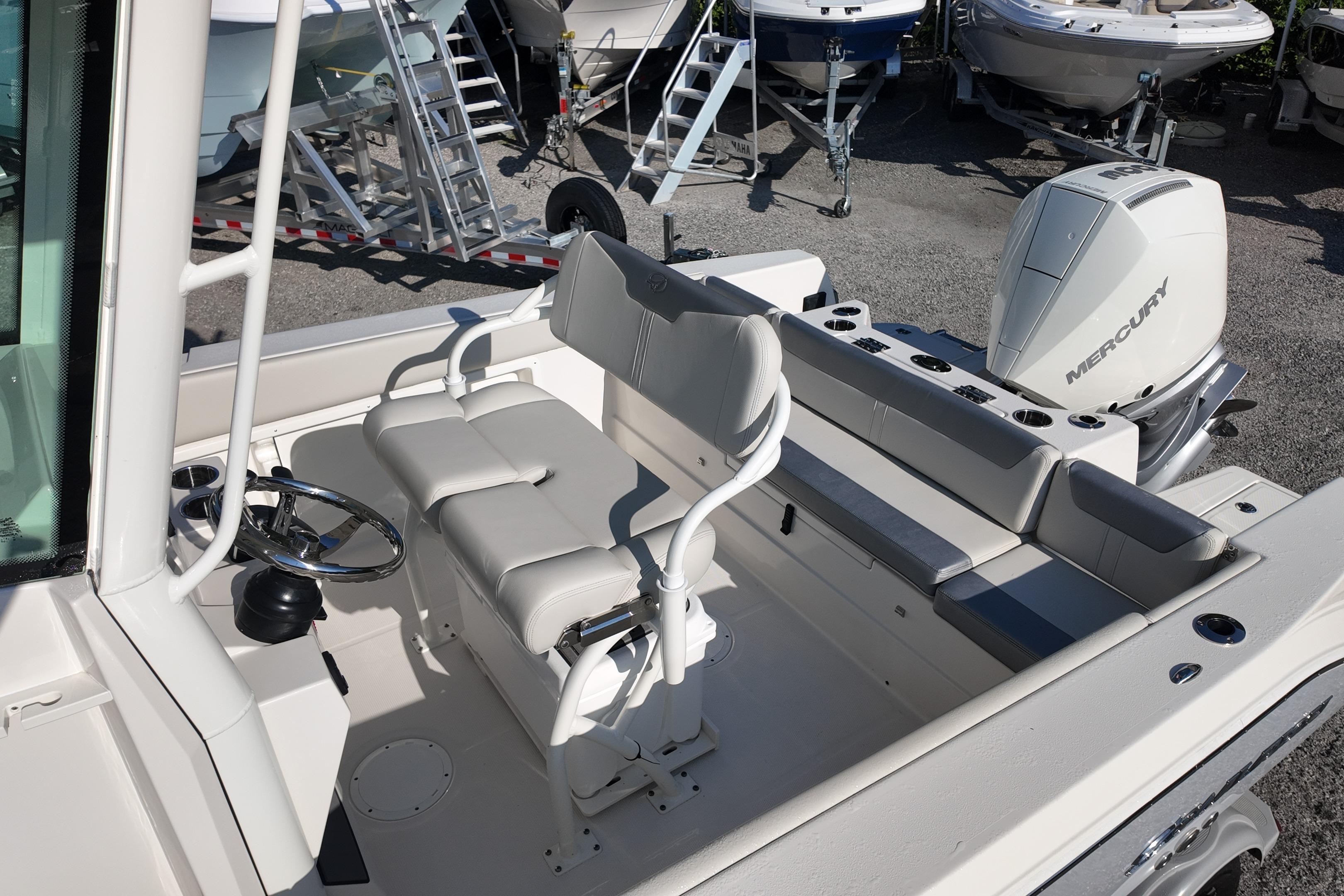 2026 Sailfish 232 CC boat interior with seating and Mercury engine.