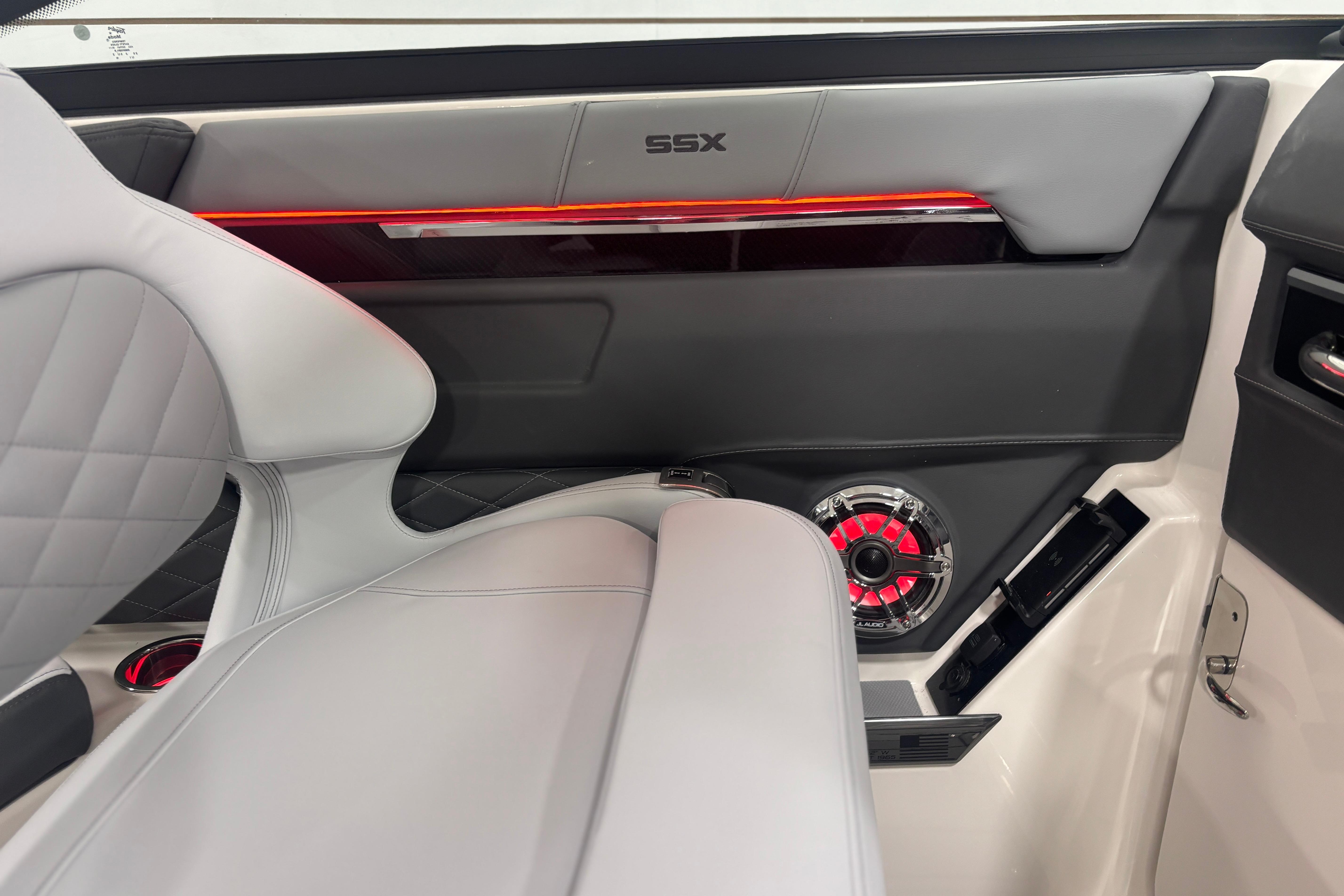 2026 Chaparral SSX 30 interior with modern design, featuring sleek seating and stylish speaker system.