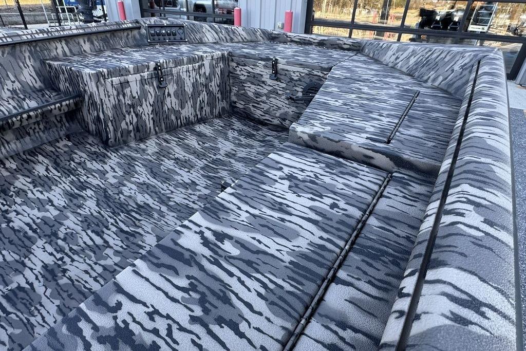 2026 Havoc 1756 boat interior with camouflage pattern, featuring spacious seating and storage.