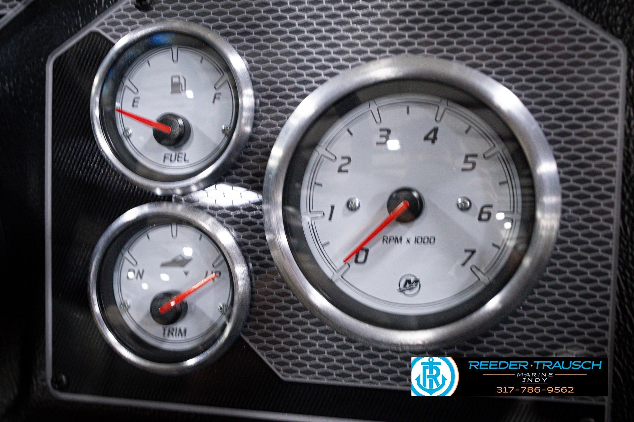 Dashboard gauges of 2026 Lund 1775 Impact XS SS boat, featuring fuel, trim, and RPM indicators.