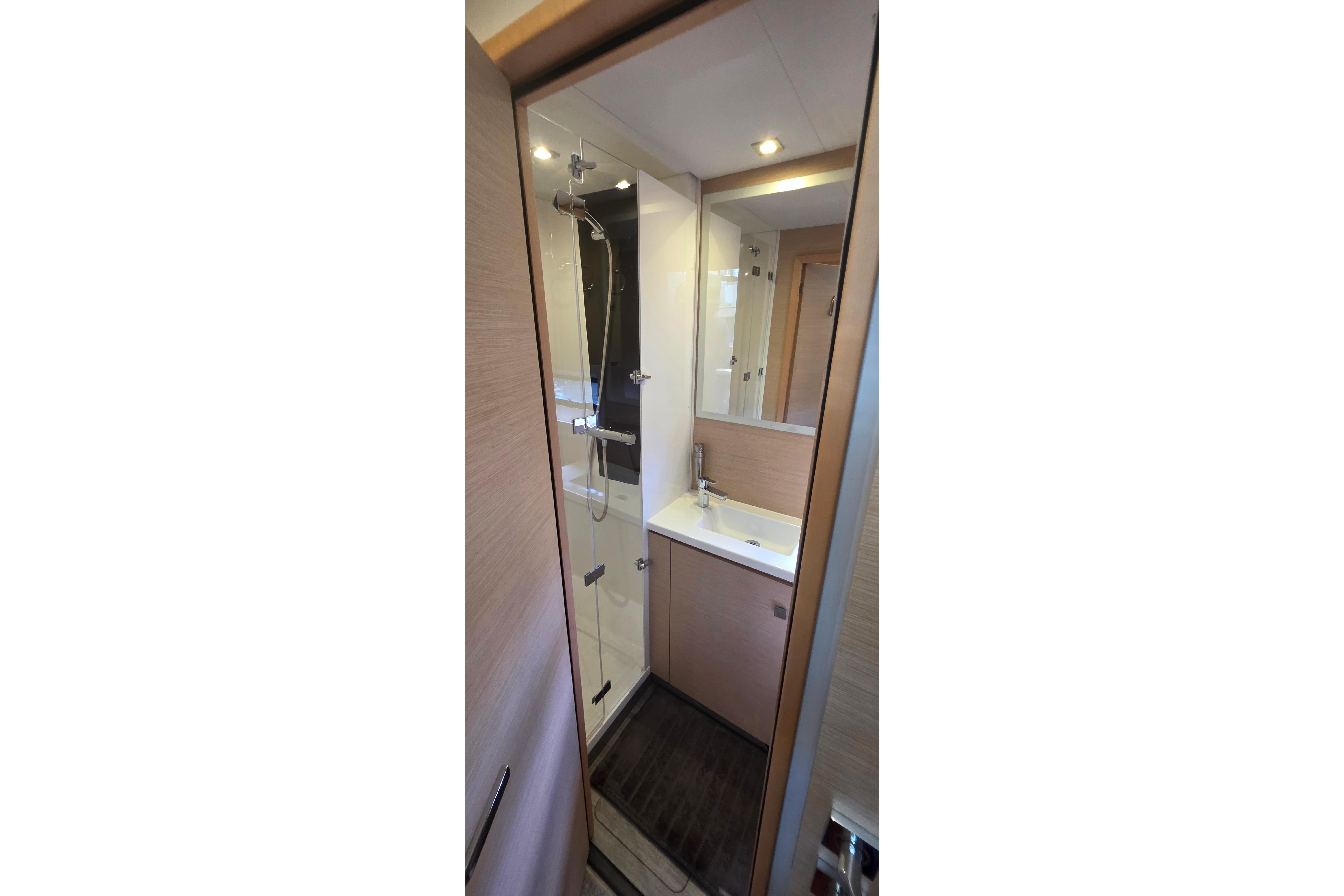 Luxurious bathroom in 2018 Fountaine Pajot Motor Yacht 44, featuring modern fixtures and elegant design.