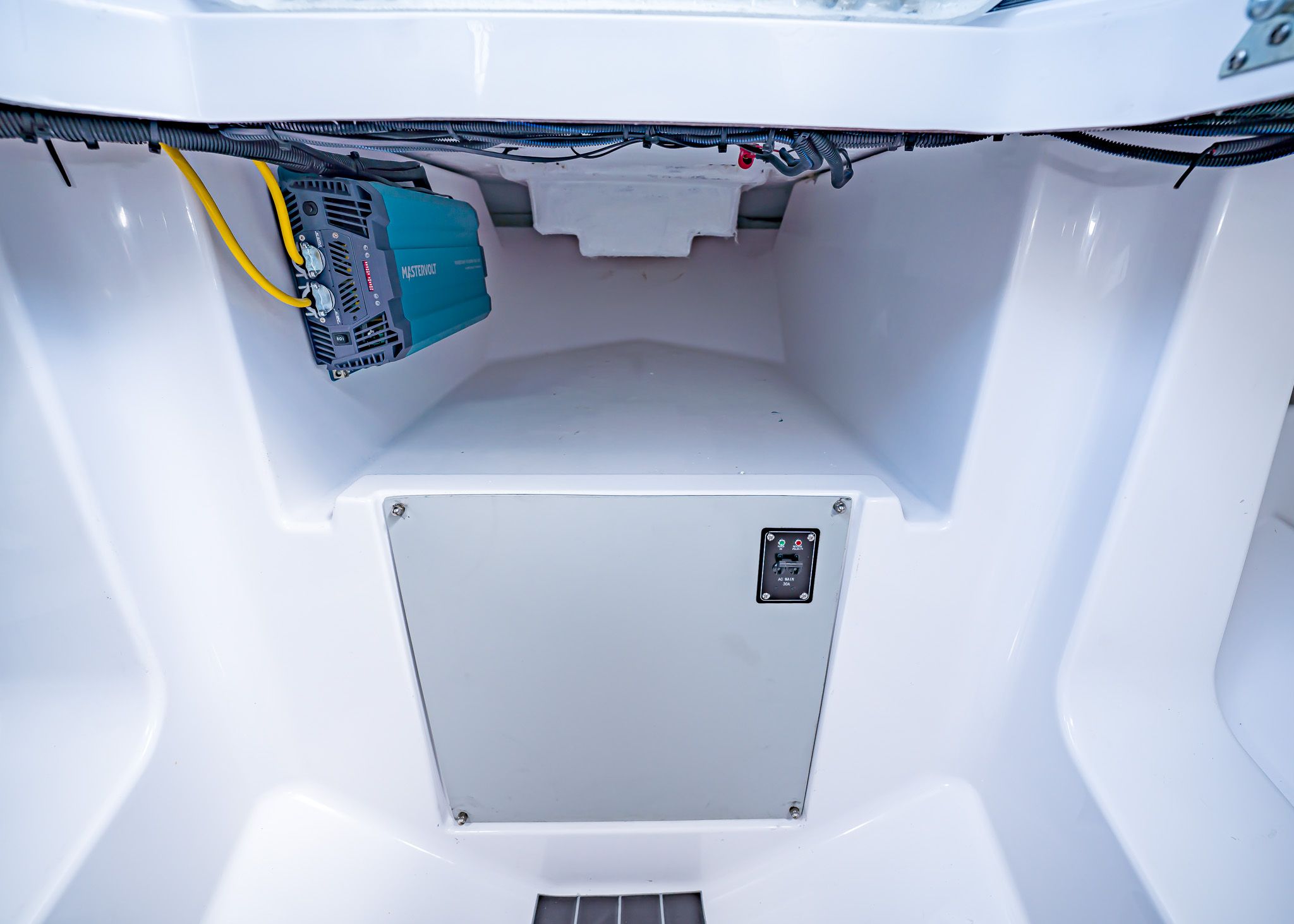 Interior of Paradigm 266 SL SURF 2025 with electrical wiring.