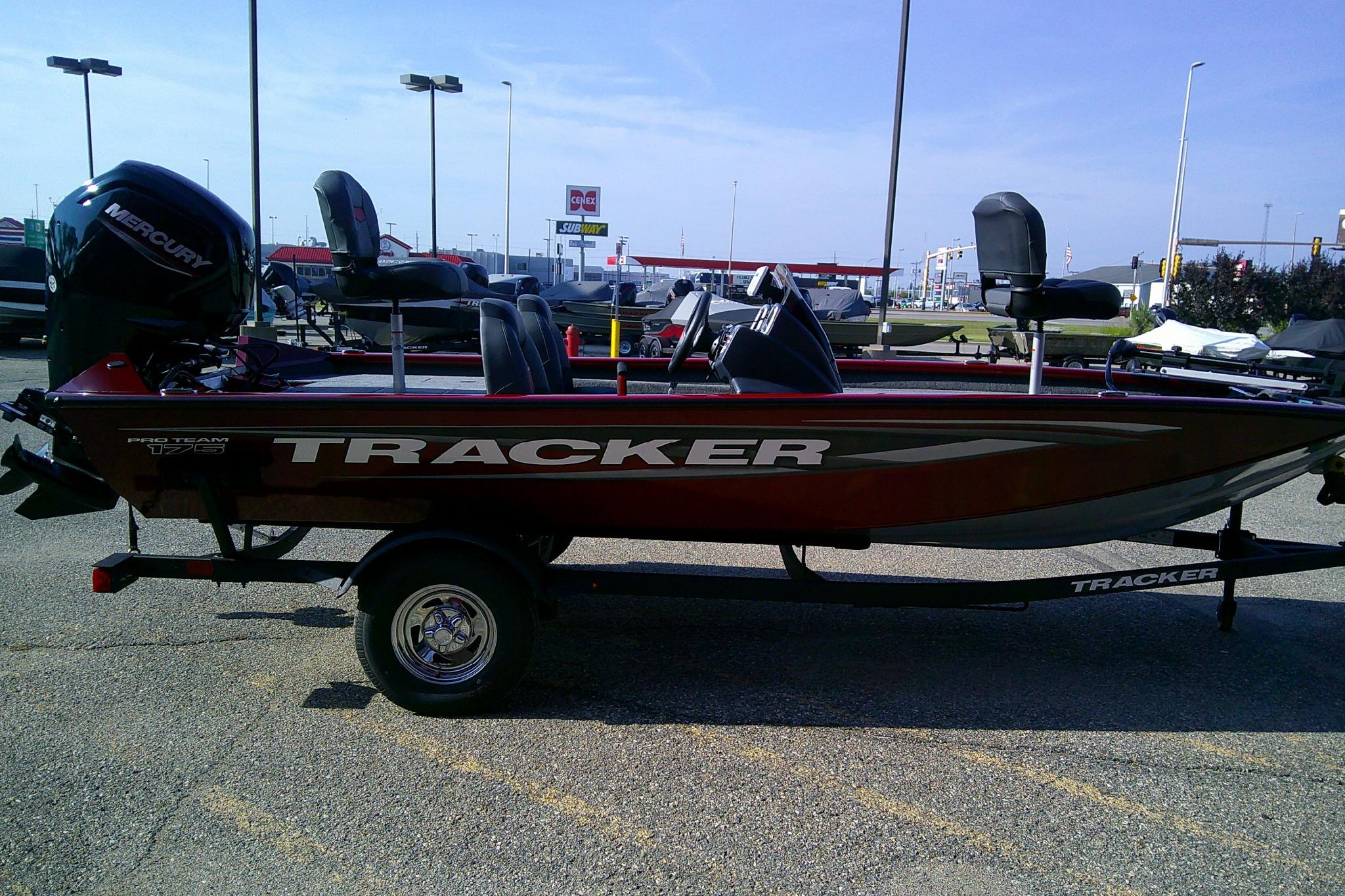 2025 Tracker Pro Team 175 boat on trailer in parking lot.