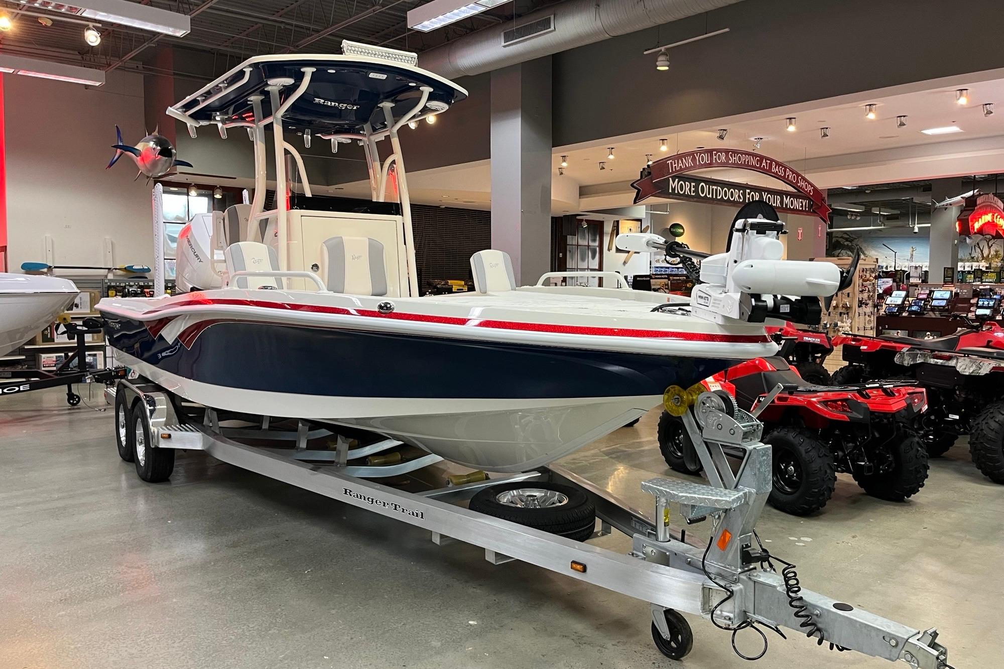 2026 Ranger 2510 Bay boat on trailer in showroom, featuring sleek design and modern equipment.