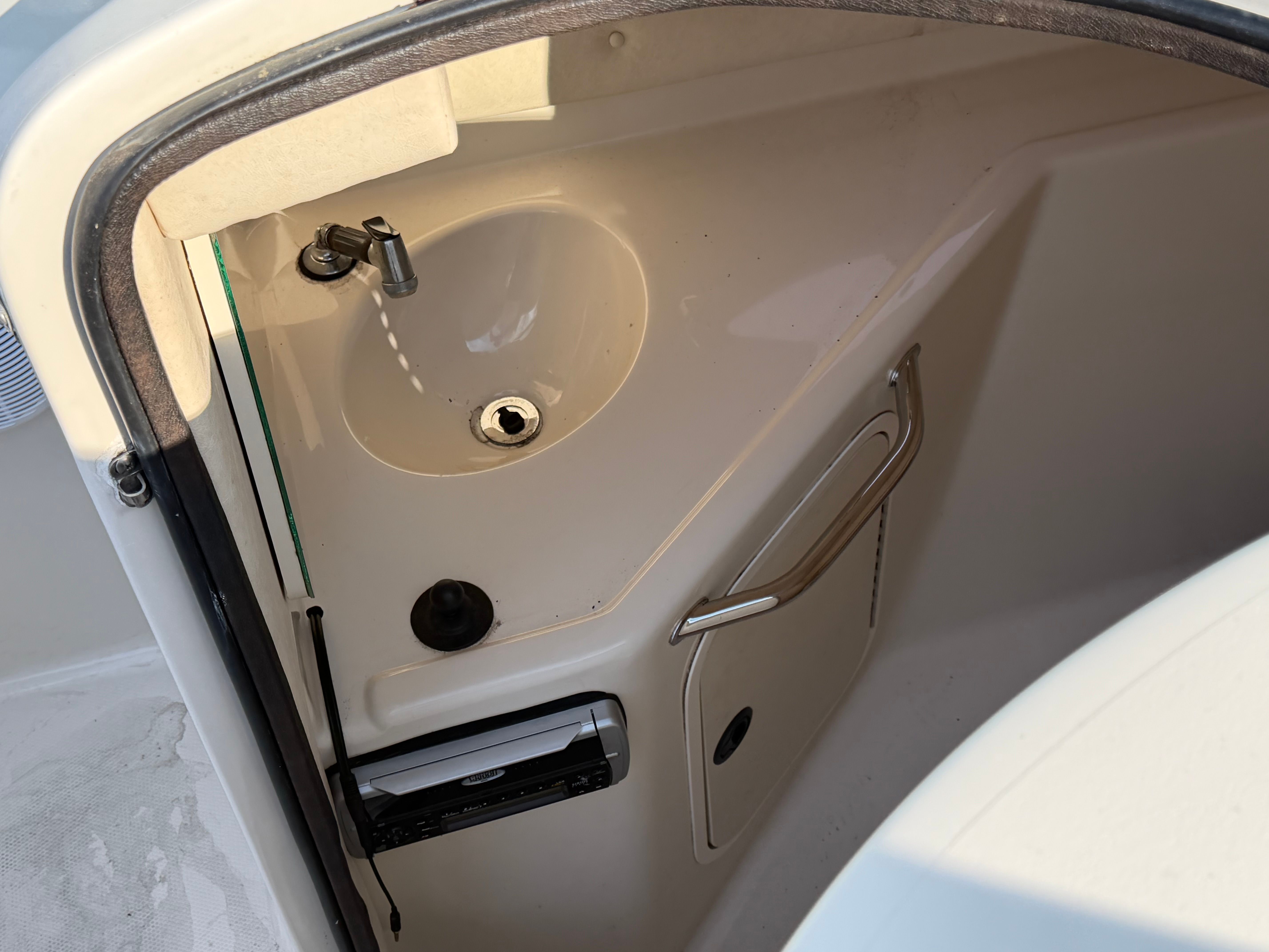 Interior of 2004 Sea Ray 270 Sundeck with sink.