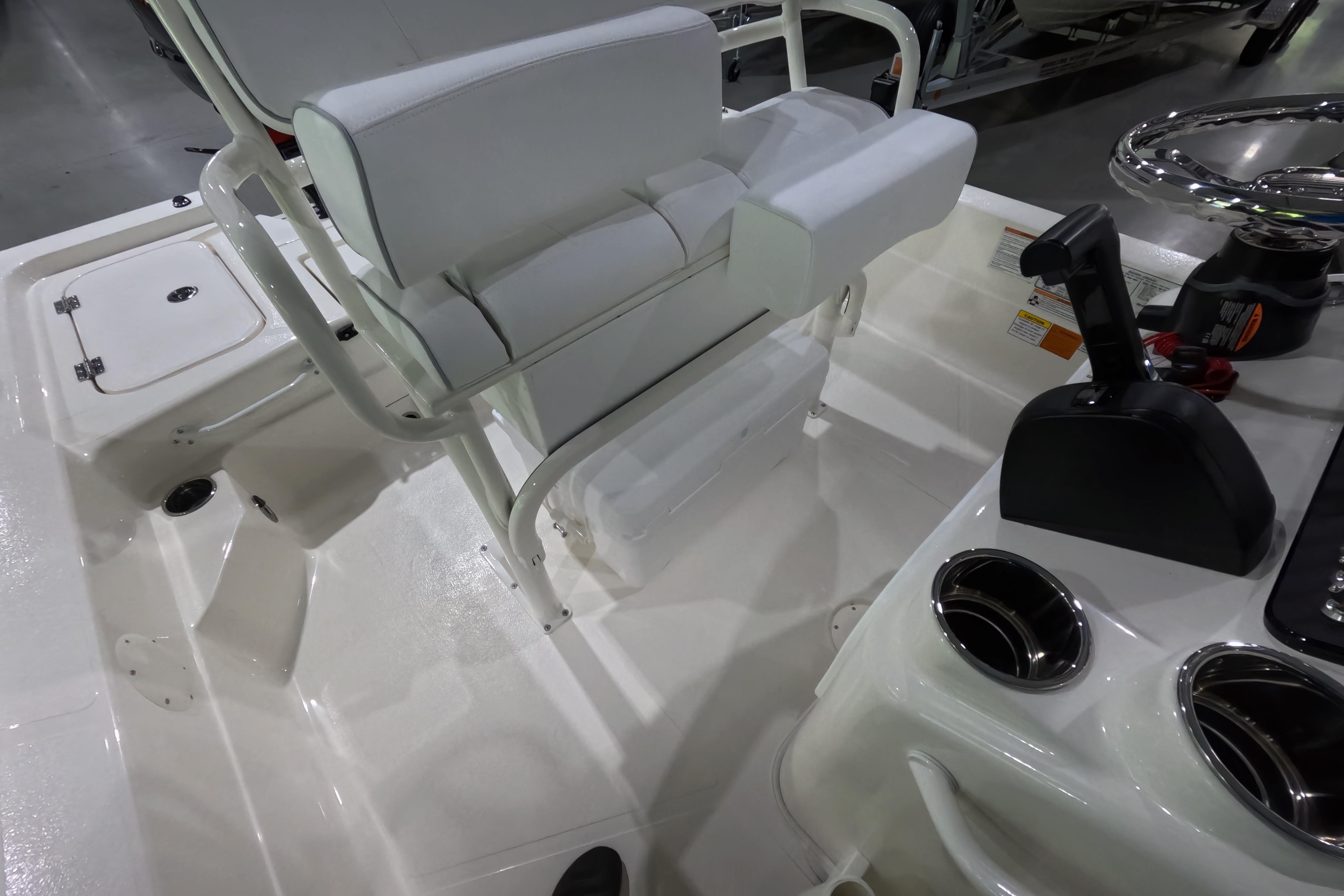 Interior view of 2026 Skeeter SX221 boat, featuring seating and control console.