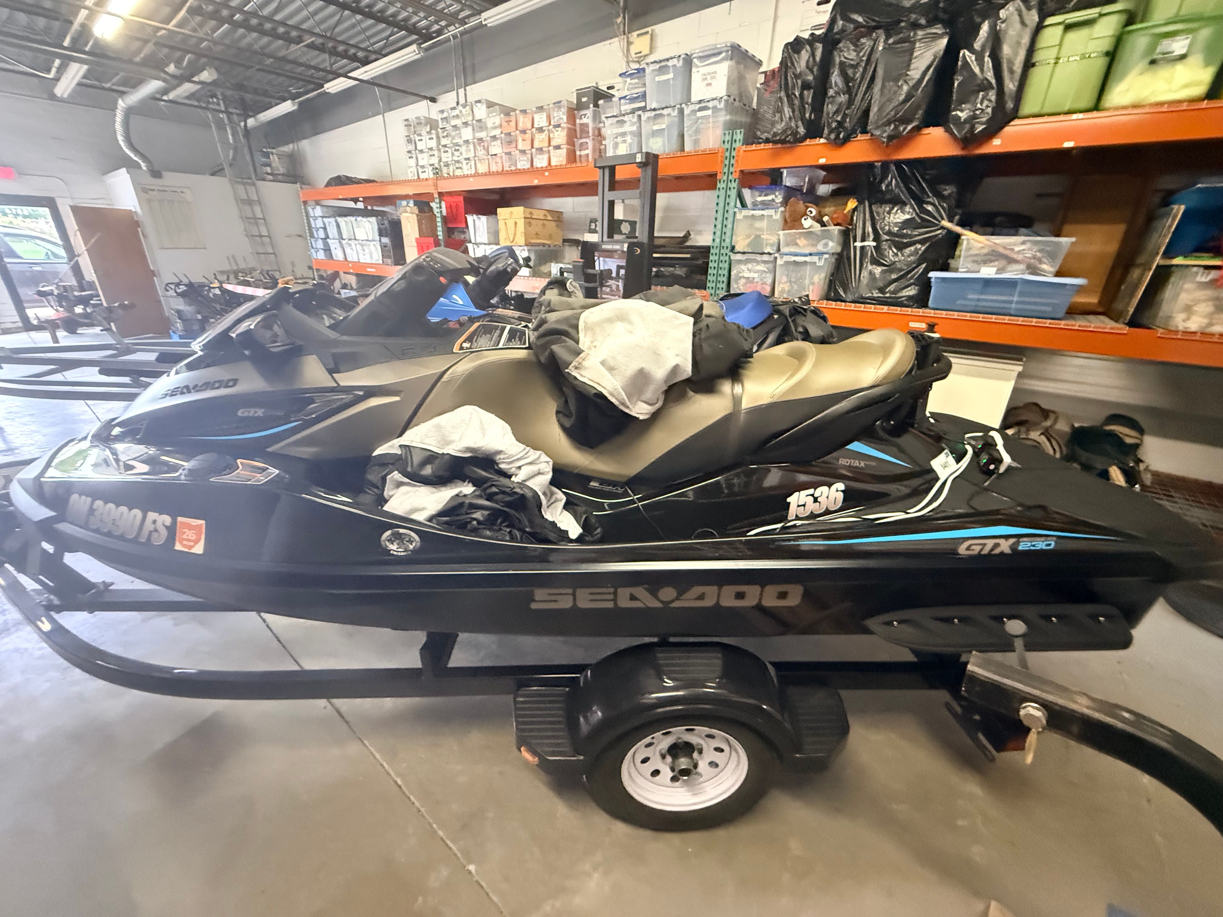 2017 Sea-Doo GTX 230 jet ski in warehouse on trailer.