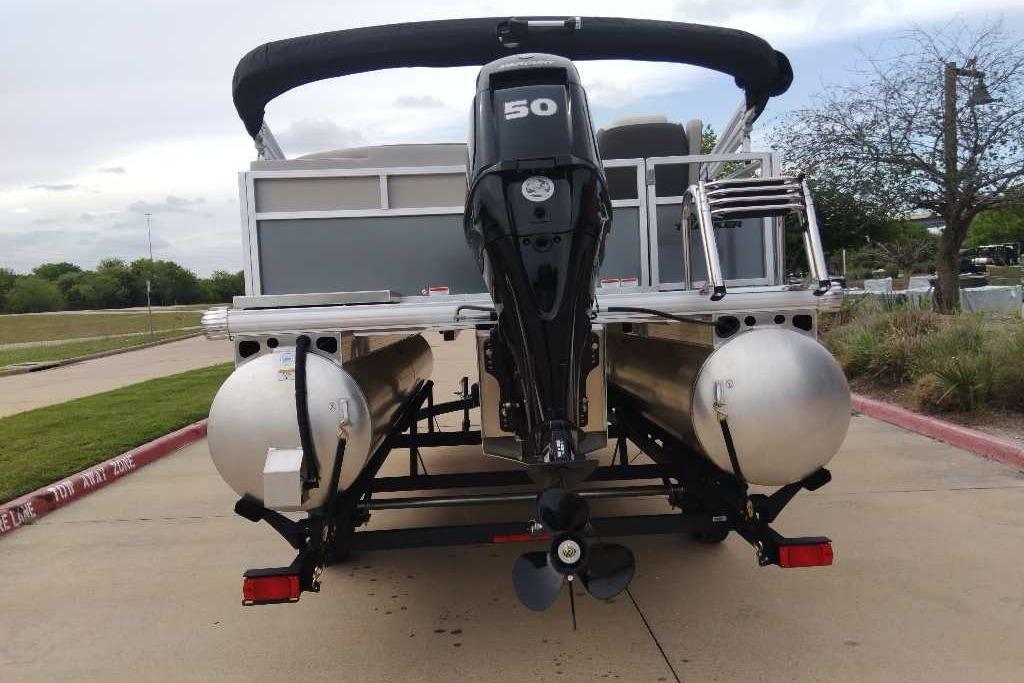 2026 Sun Tracker Bass Buggy 16 XL Select pontoon boat with 50 HP outboard motor.