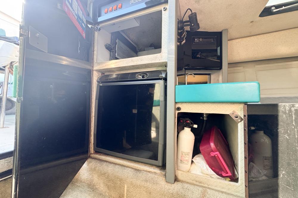 Interior of a 1989 Formula 292 SR-1 boat showing storage compartments and equipment.