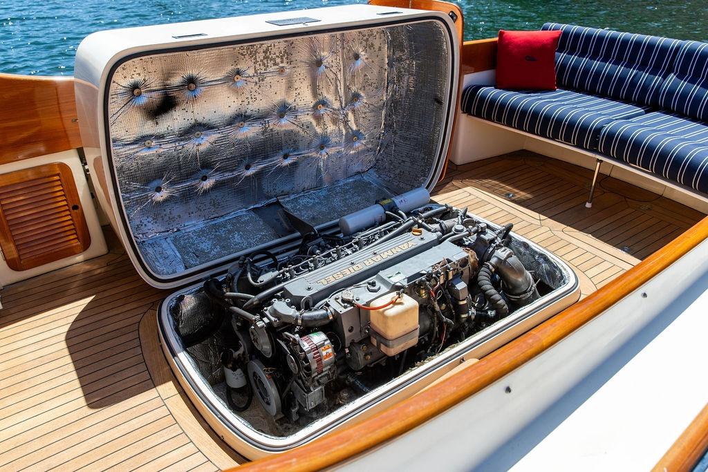 Hinckley Picnic Boat 36 Classic 2000 engine compartment with open hatch, showcasing detailed mechanics.
