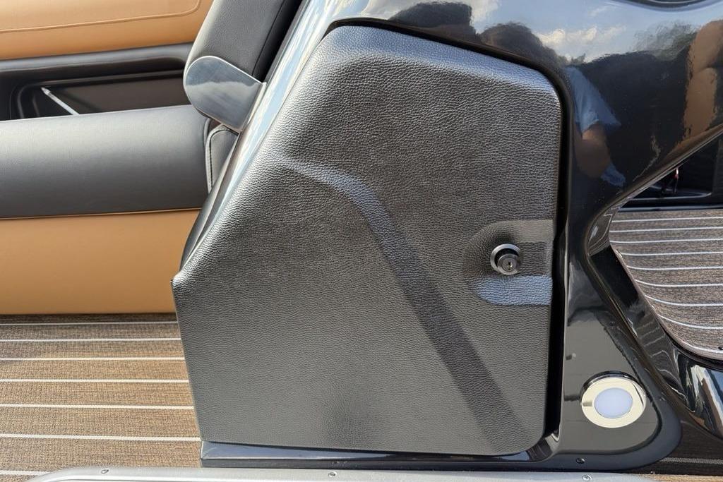 Interior detail of 2026 Premier 250 Solaris RS CL boat, featuring sleek black and tan design.
