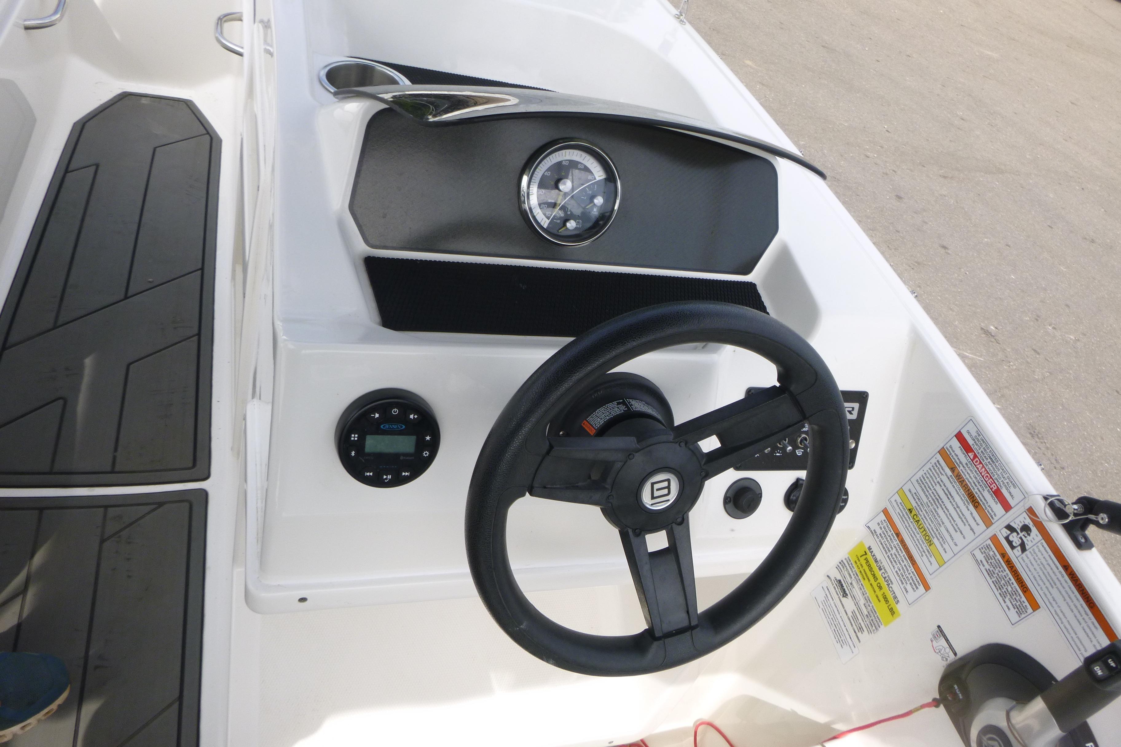 2022 Bayliner Element M17 boat dashboard with steering wheel and control panel.