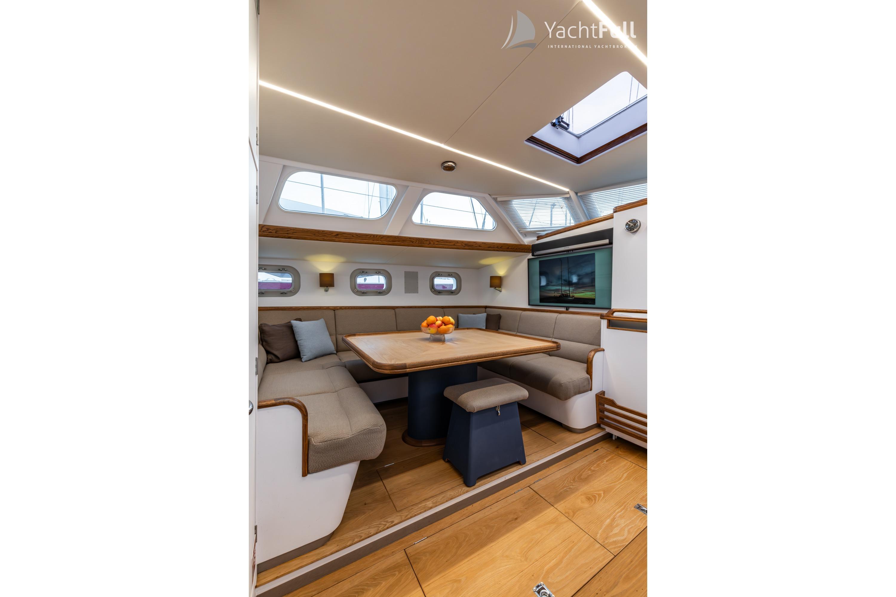Luxurious interior of 1987 Nordia Van Dam 82 ketch with elegant dining area.