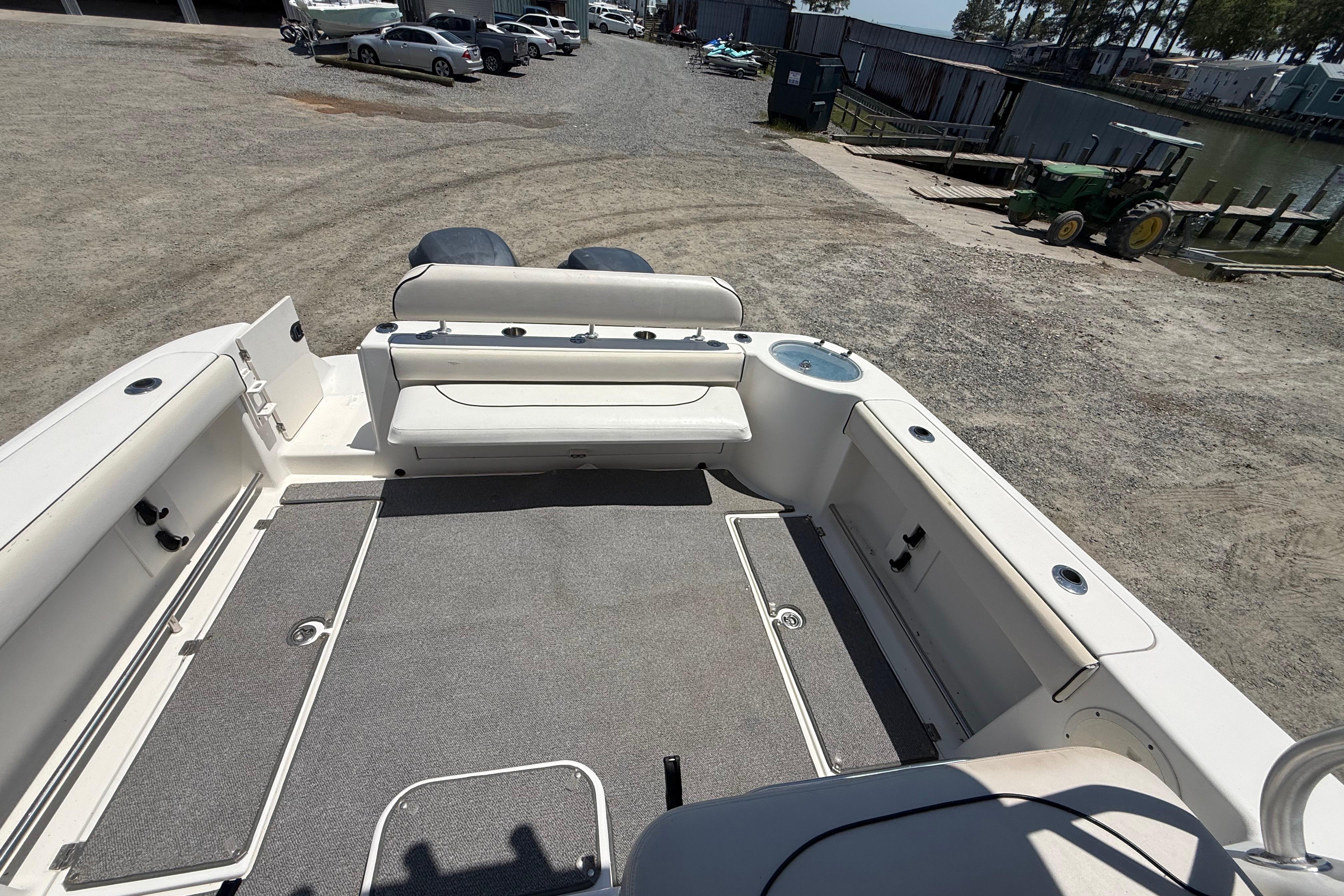 2007 Robalo R305 Walkaround boat deck with seating and storage compartments.