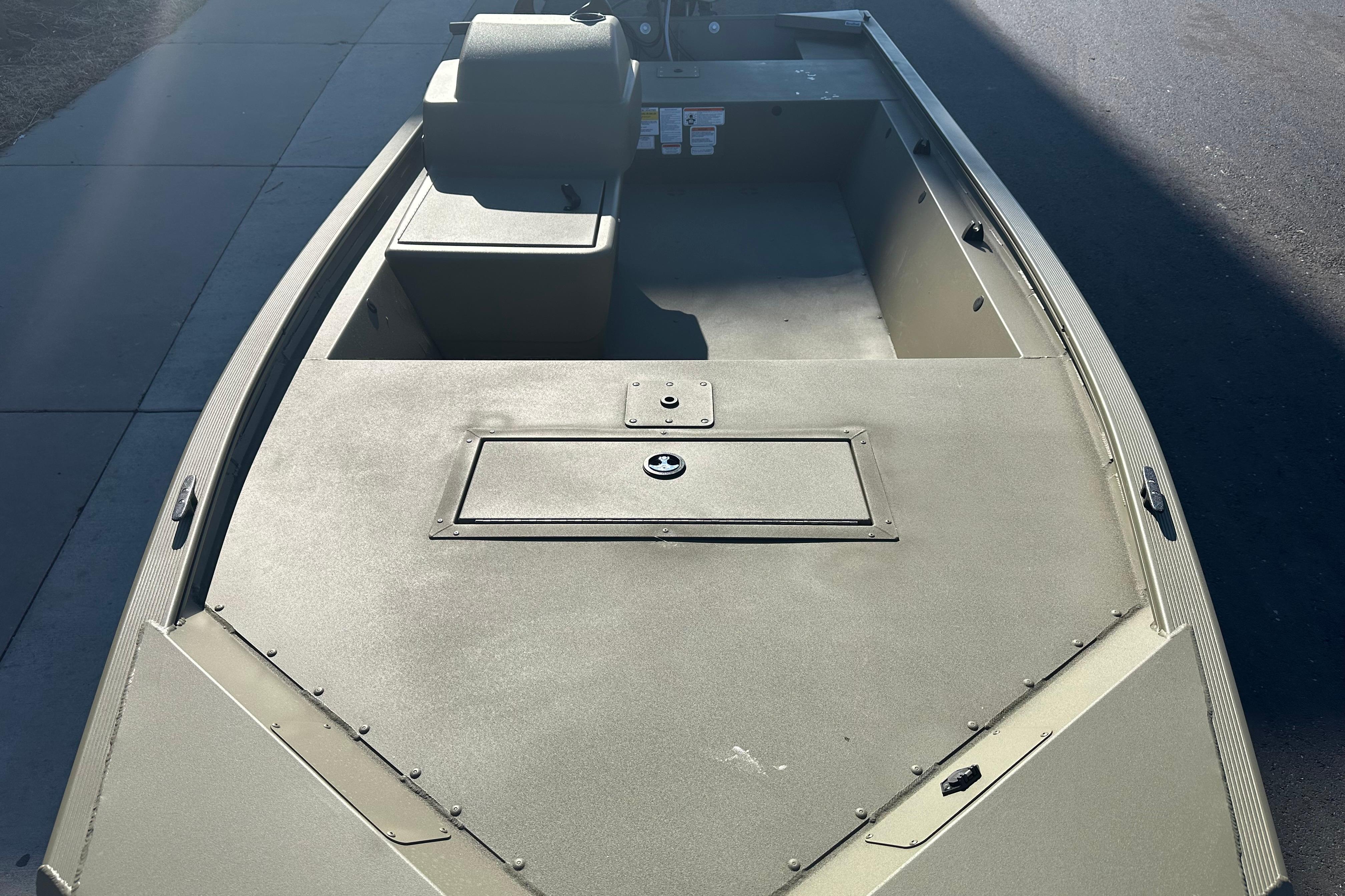 2026 Tracker Grizzly 1648 SC boat interior, showcasing spacious deck and storage compartments.