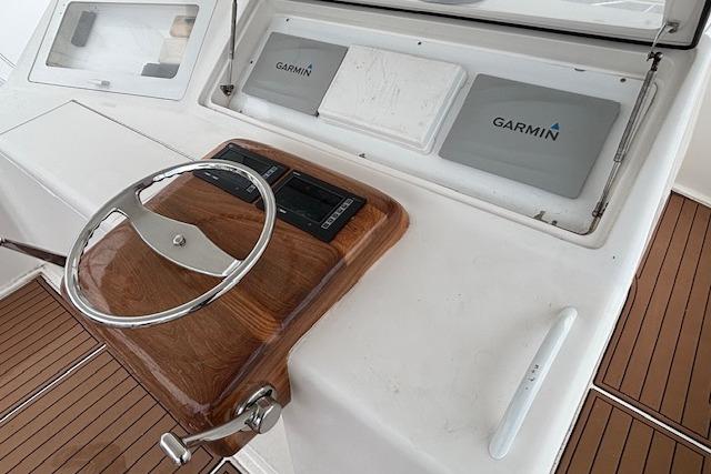 Steering console of 2007 Viking 52 Convertible yacht with Garmin navigation systems.