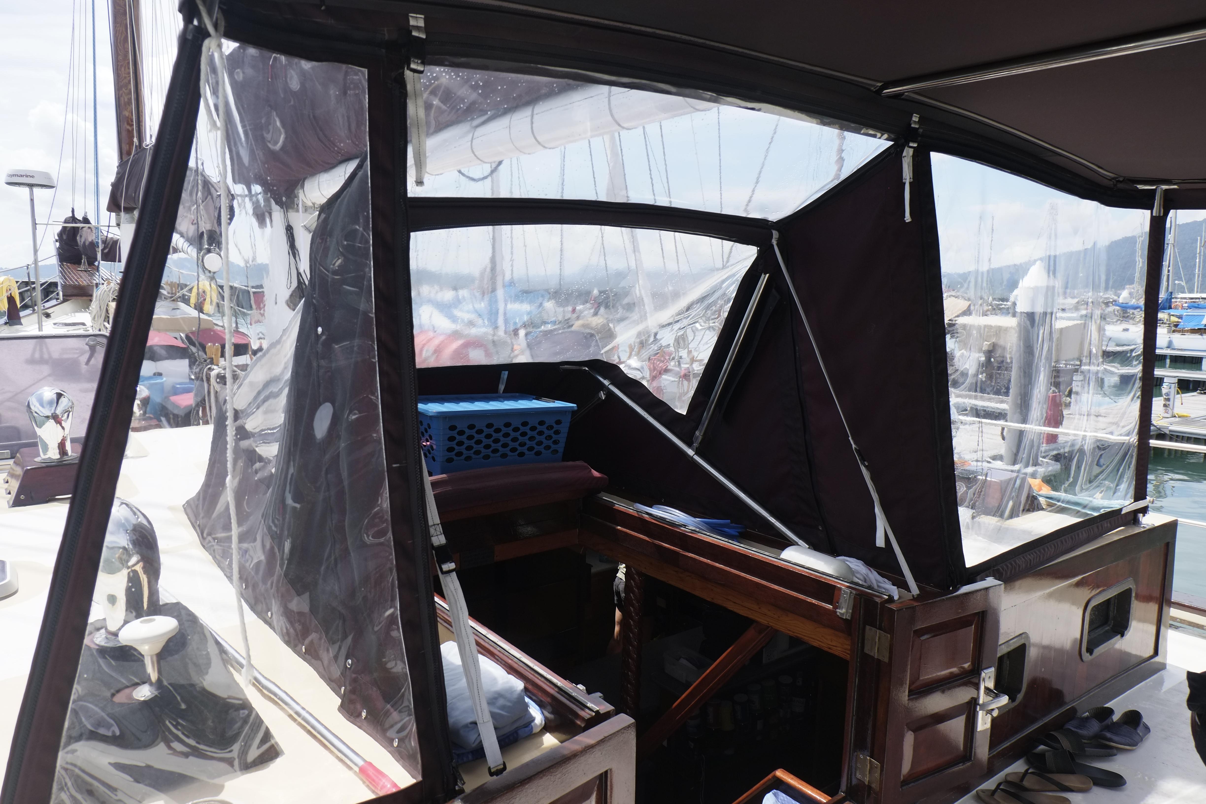 Custom Bud Macintosh schooner, 2006 model, with covered cockpit and marina view.