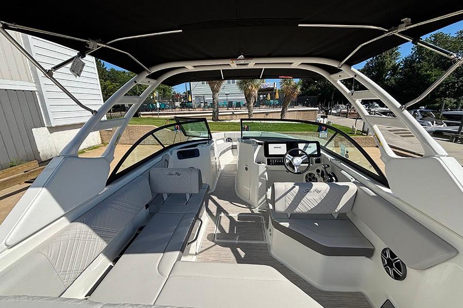 2027 Sea Ray SDX 230 Outboard boat interior with modern seating and steering console.